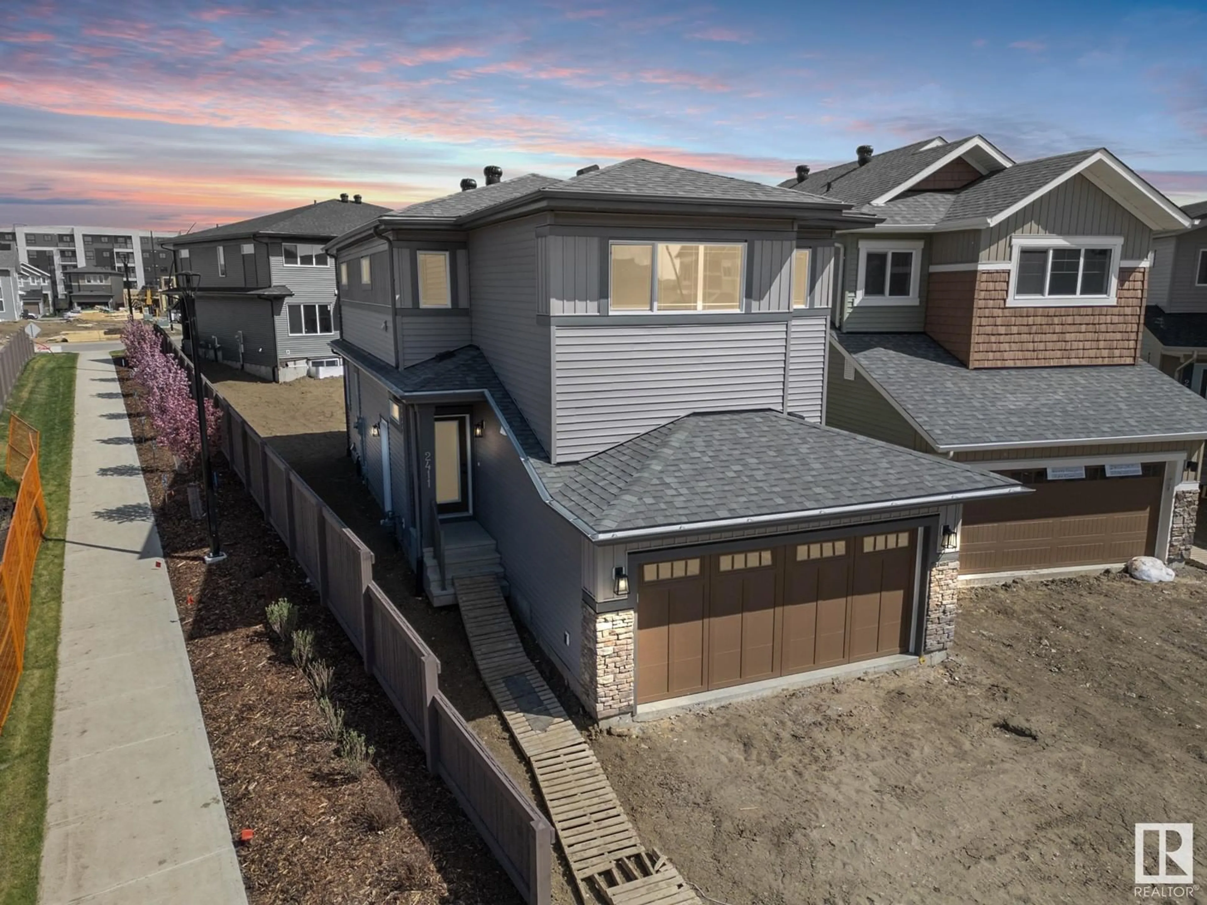 A pic from outside/outdoor area/front of a property/back of a property/a pic from drone, street for NW - 2411 207 ST, Edmonton Alberta T6M2C4