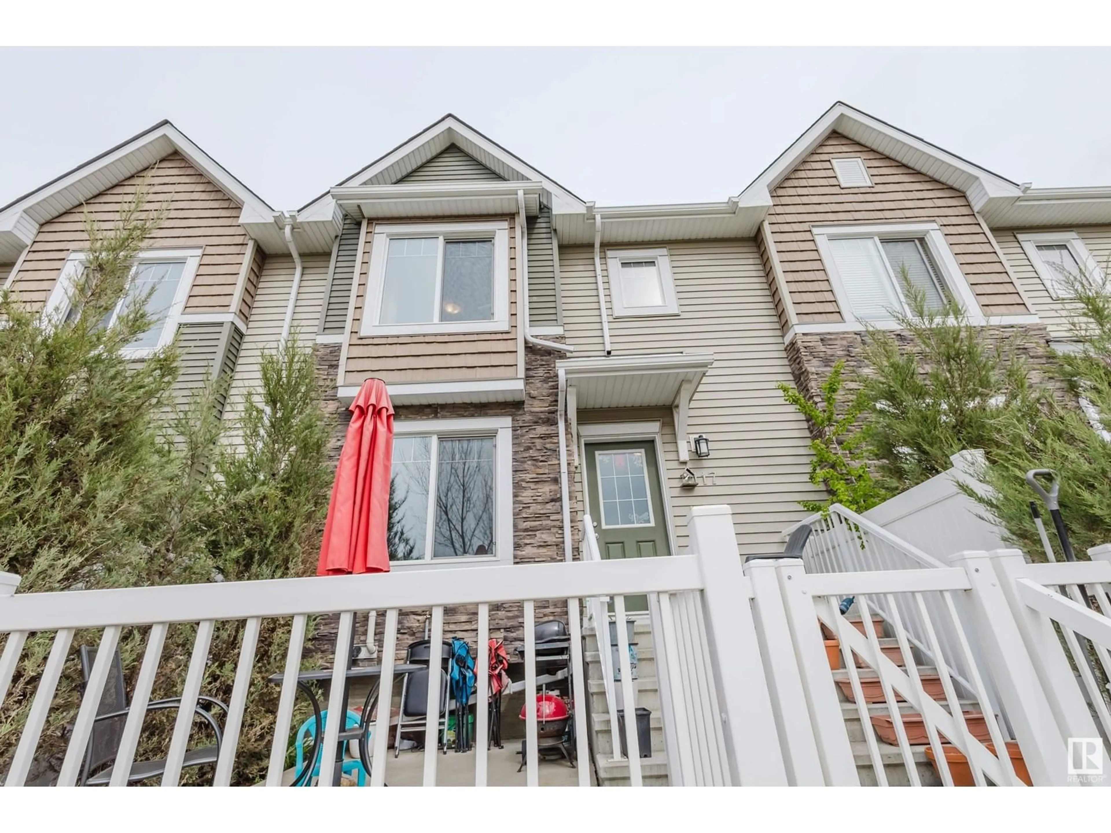 Home with vinyl exterior material, street for #117 - 3625 144 AV, Edmonton Alberta T5Y0T3