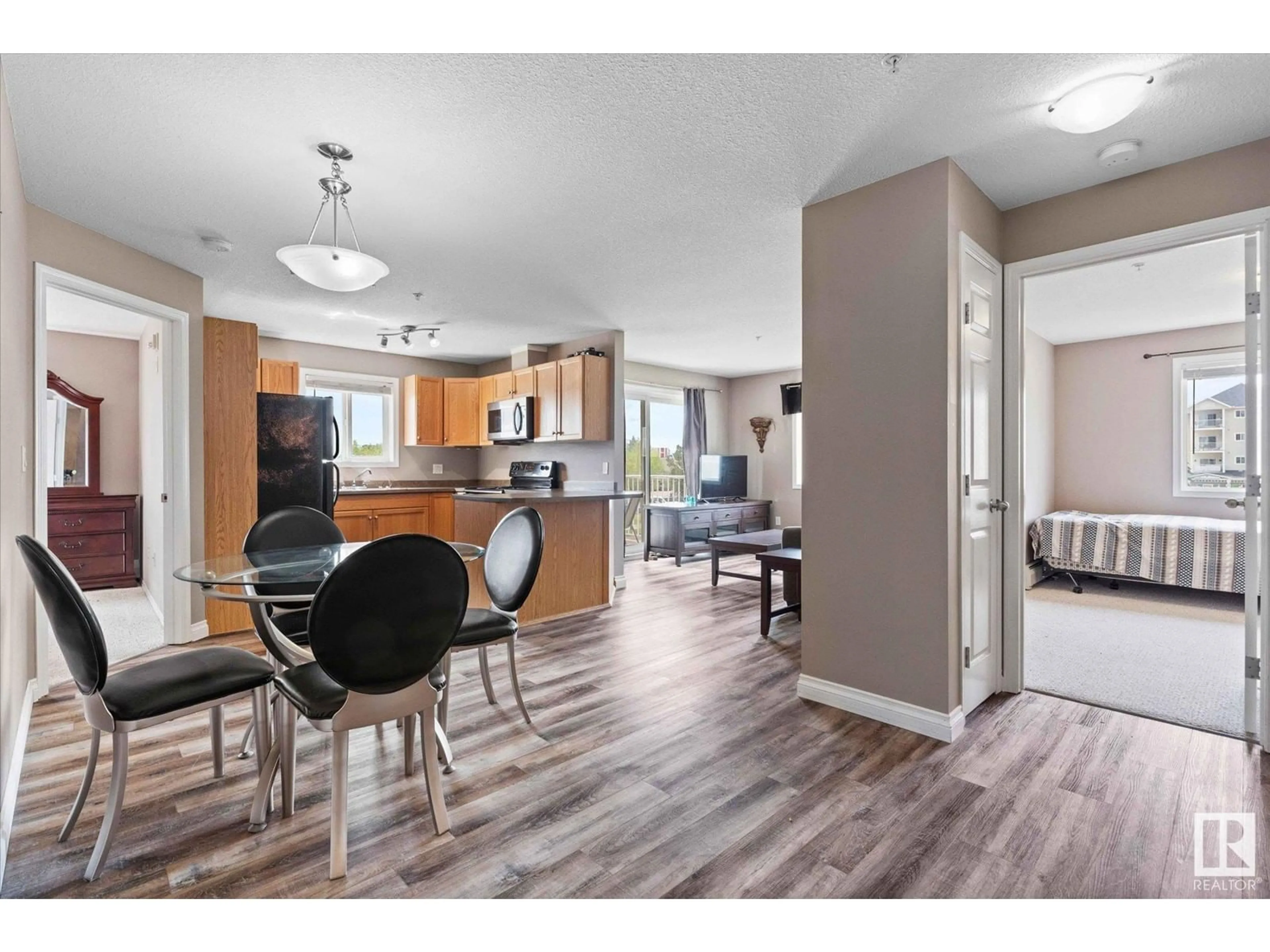 Open concept kitchen, wood/laminate floor for 201 - 4309 33 ST, Stony Plain Alberta T7Z0C4