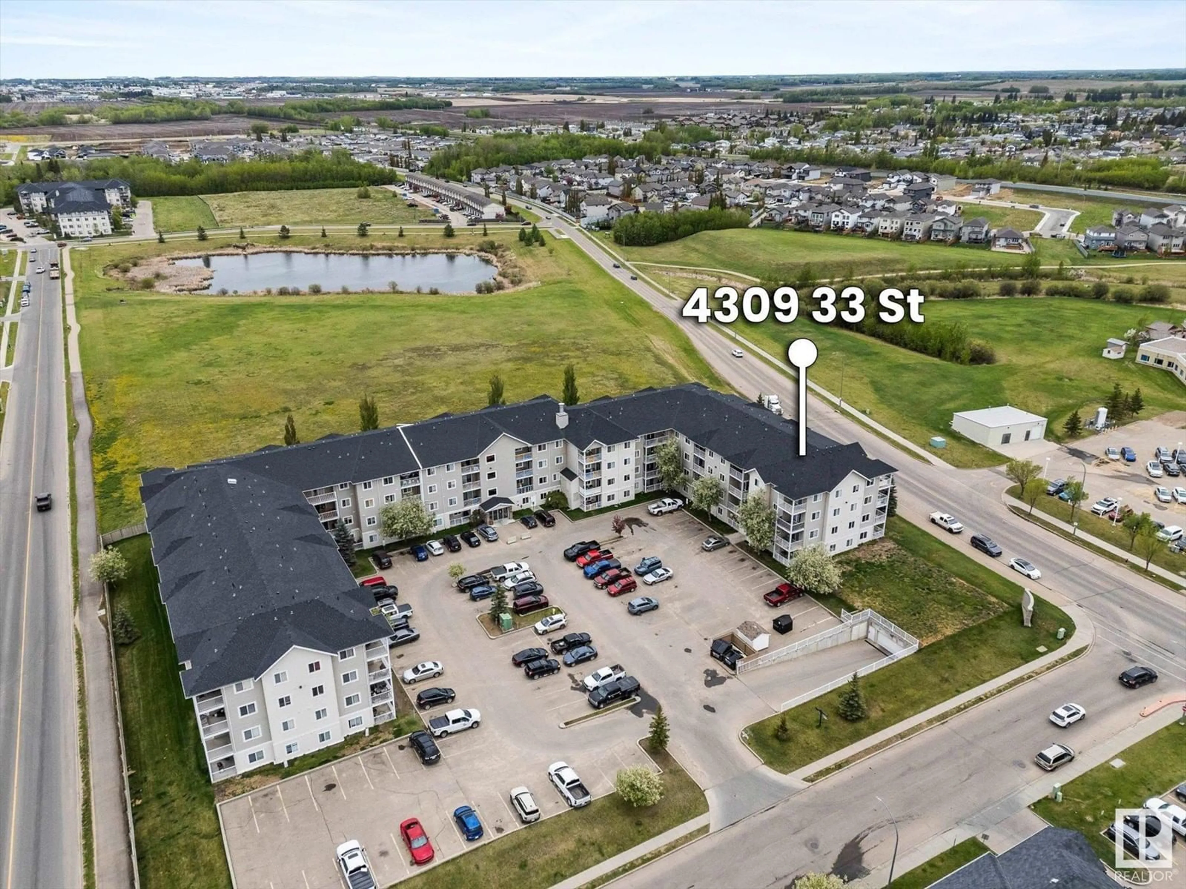 A pic from outside/outdoor area/front of a property/back of a property/a pic from drone, water/lake/river/ocean view for 201 - 4309 33 ST, Stony Plain Alberta T7Z0C4
