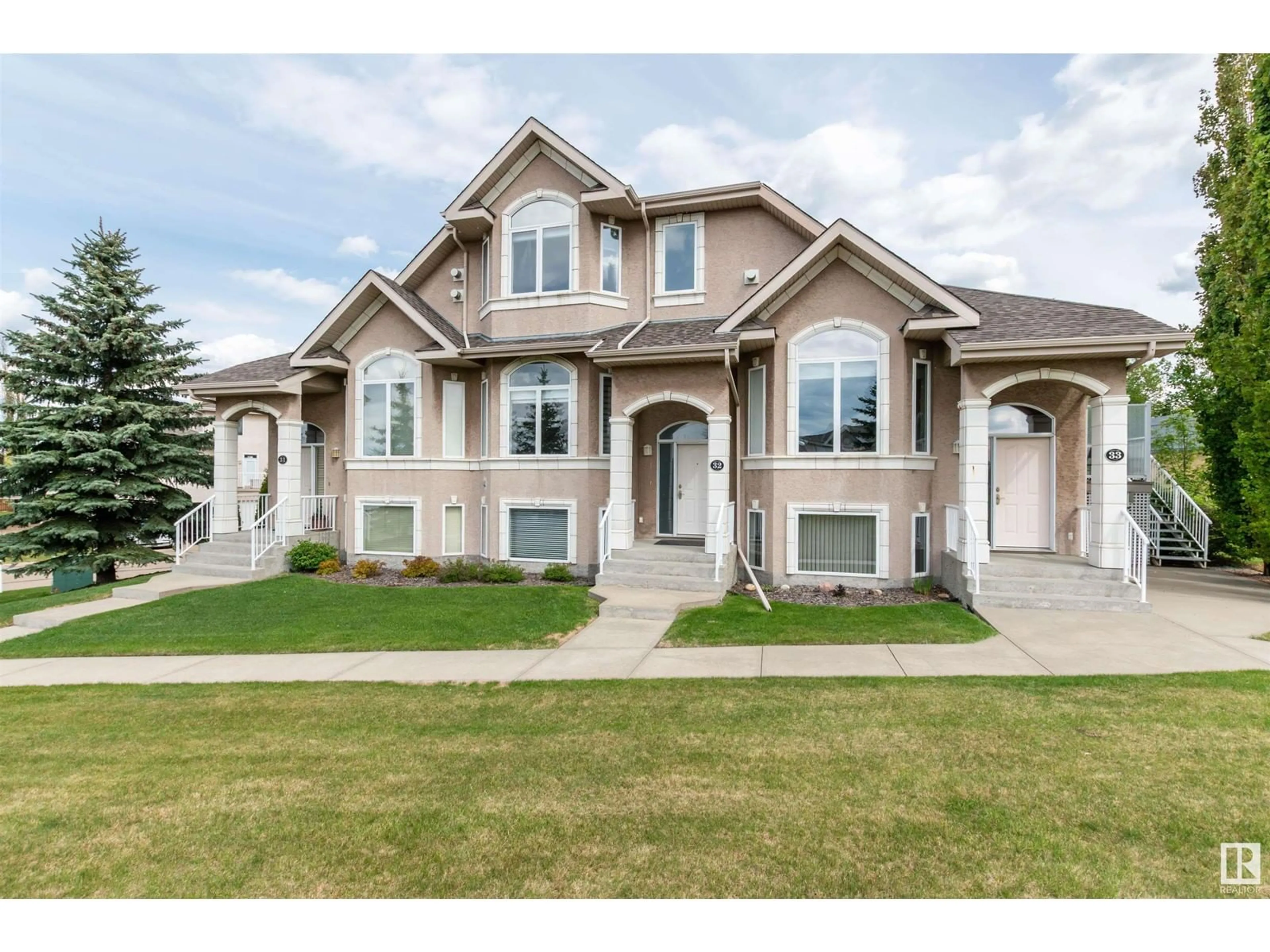 Home with brick exterior material, street for 32 101 JIM COMMON DR, Sherwood Park Alberta T8H2M1