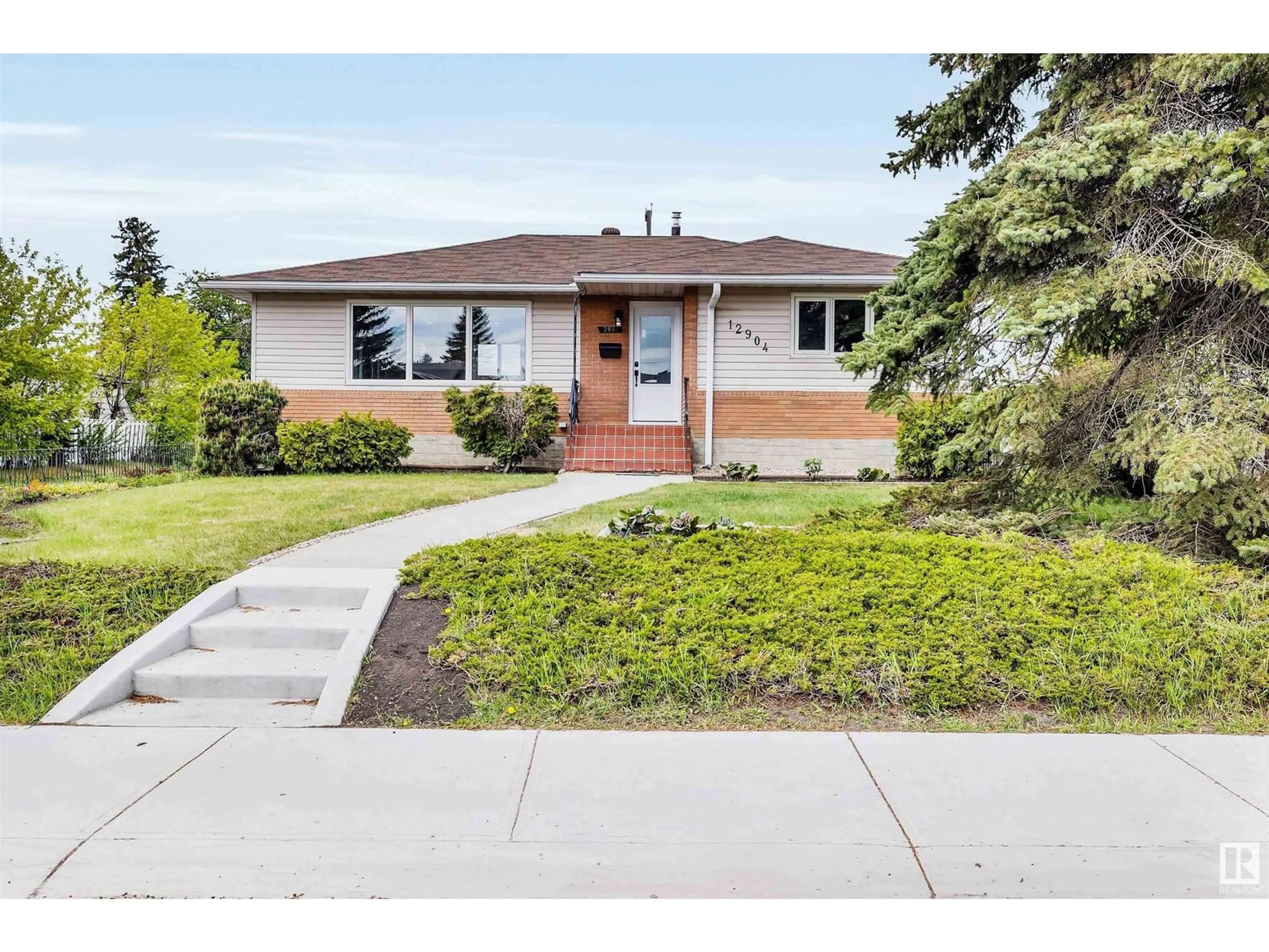Home with vinyl exterior material, street for 12904 95A ST, Edmonton Alberta T5E4A1