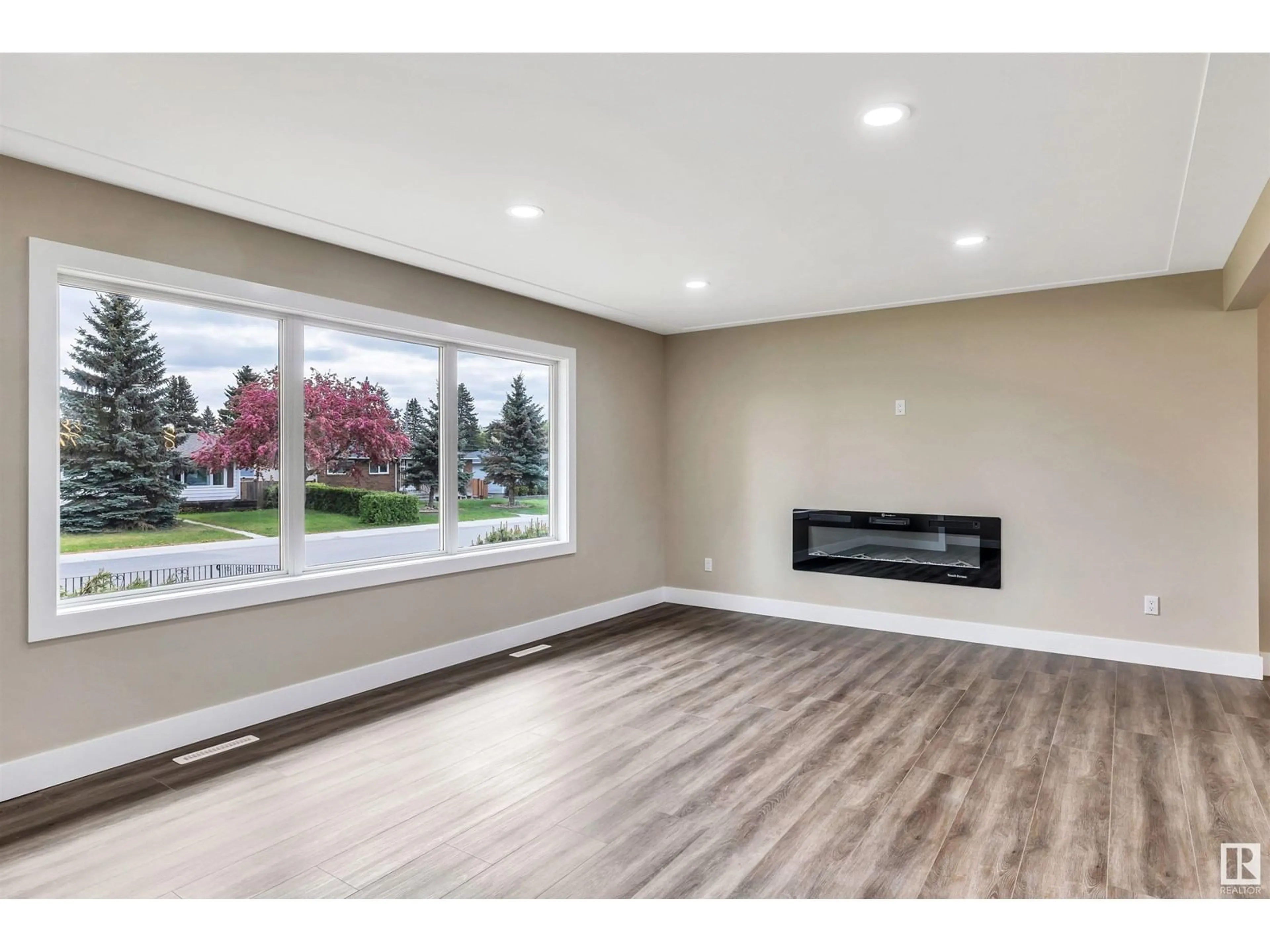 Living room with furniture, wood/laminate floor for 12904 95A ST, Edmonton Alberta T5E4A1