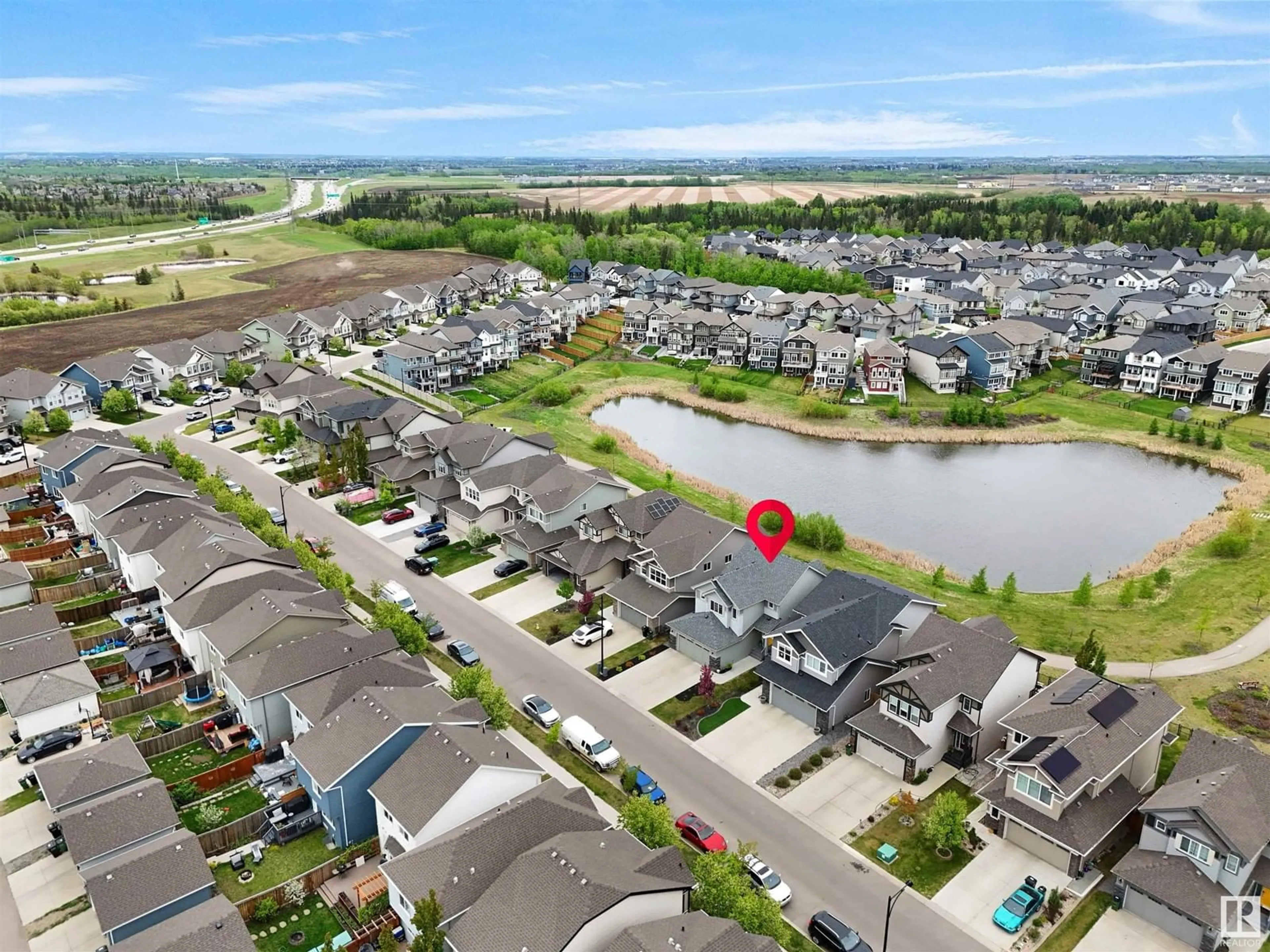 A pic from outside/outdoor area/front of a property/back of a property/a pic from drone, water/lake/river/ocean view for LI NW - 825 EAGLESON LINK, Edmonton Alberta T6M0V5