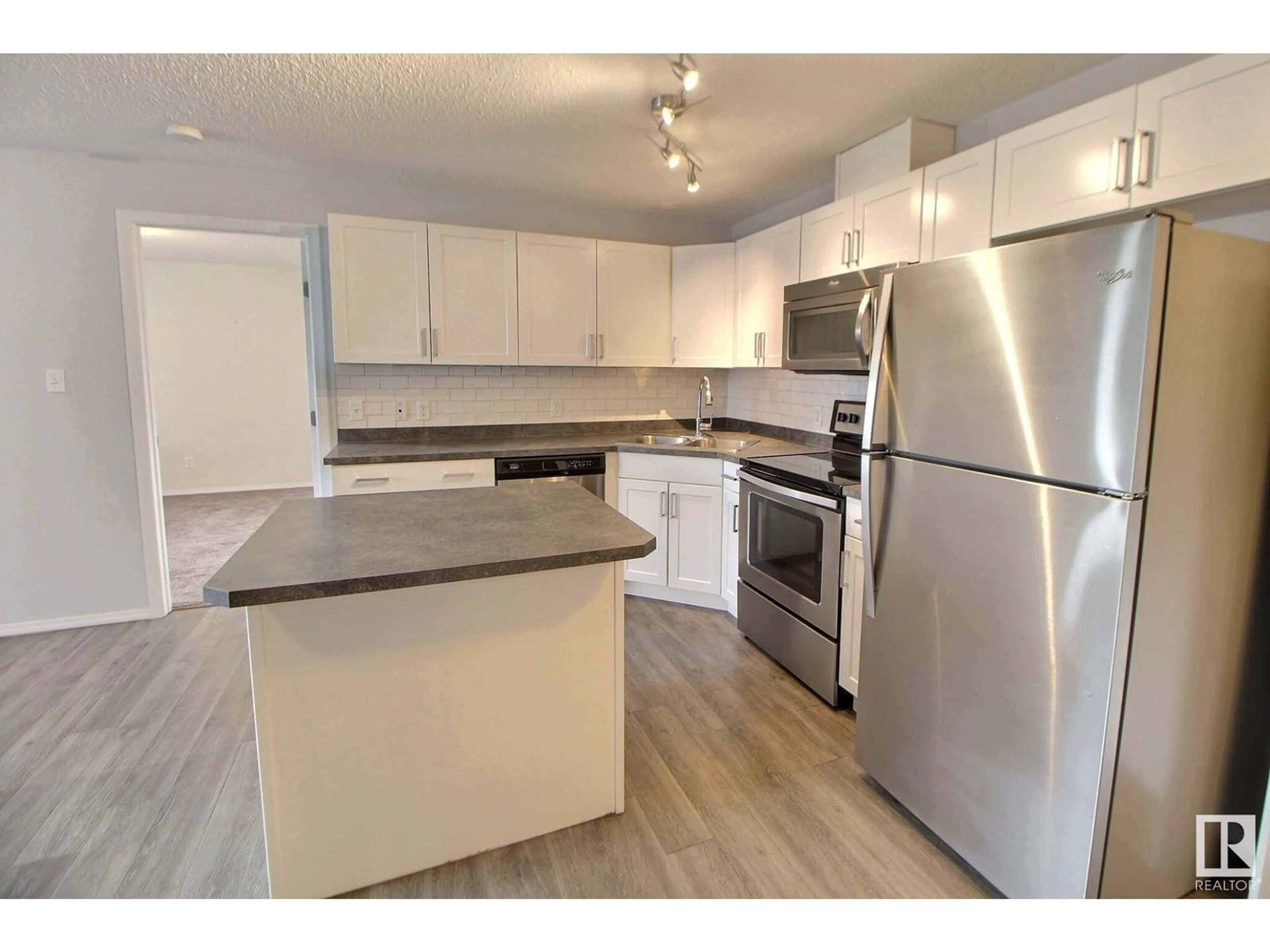 Standard kitchen, wood/laminate floor for 301 - 340 CLAREVIEW STATION DR NW, Edmonton Alberta T5Y0J4