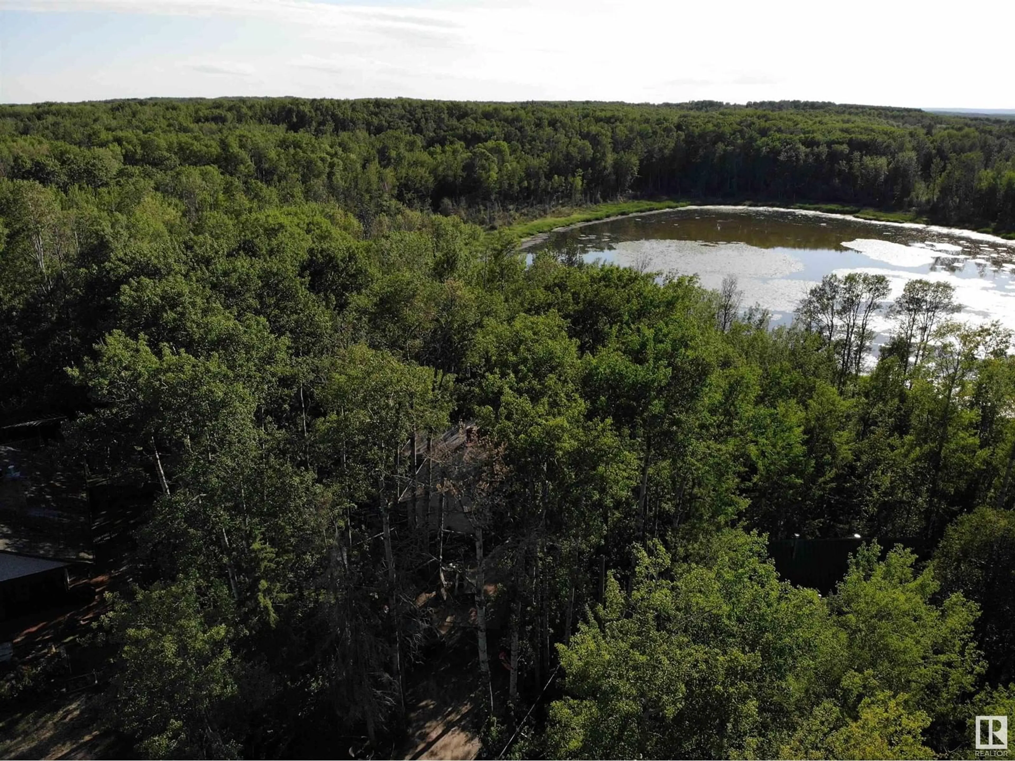 A pic from outside/outdoor area/front of a property/back of a property/a pic from drone, forest/trees view for 414 5415 TWP RD 594, Rural Barrhead County Alberta T7N1N3