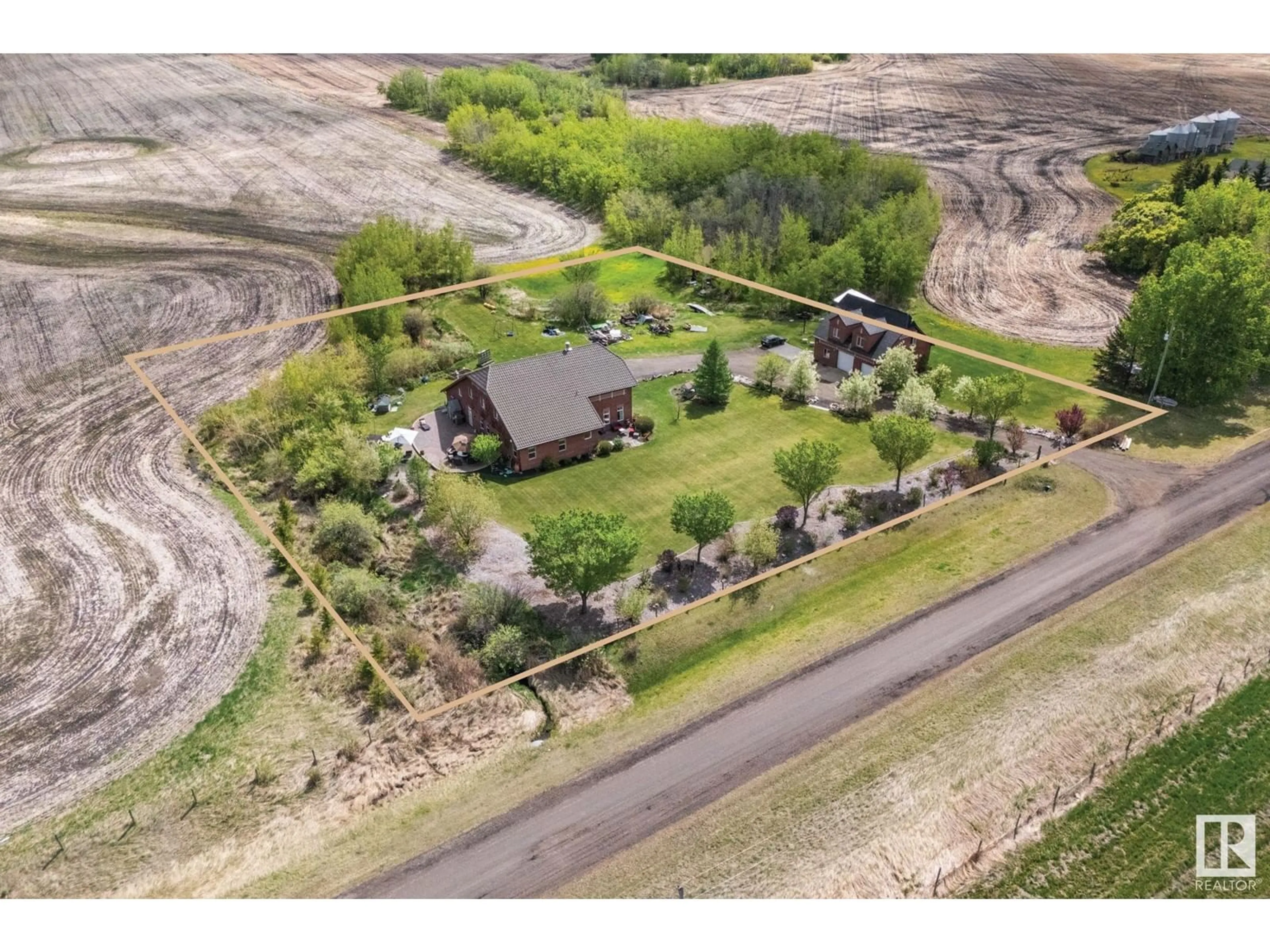 A pic from outside/outdoor area/front of a property/back of a property/a pic from drone, unknown for 53341 HWY 21, Rural Strathcona County Alberta T8A4V1