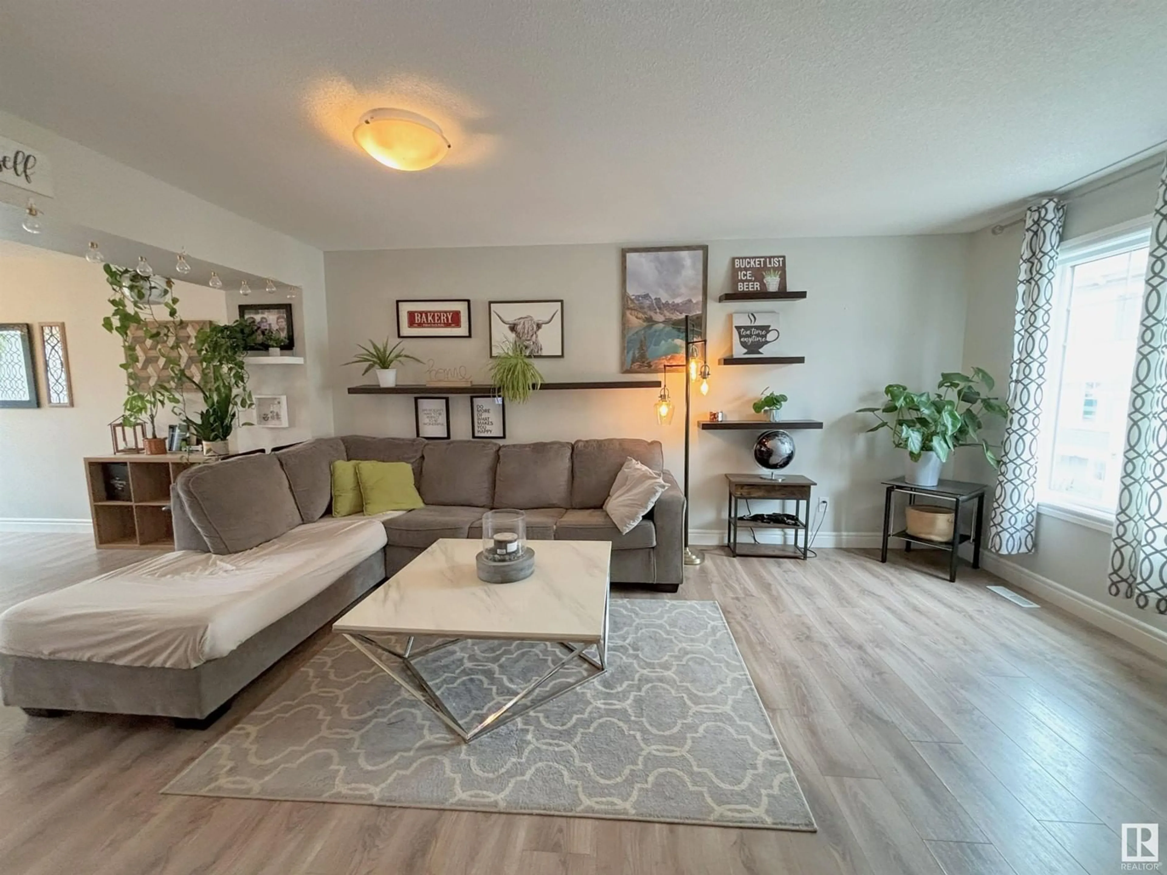 Living room with furniture, wood/laminate floor for #43 - 1391 STARLING DR, Edmonton Alberta T5S0L3