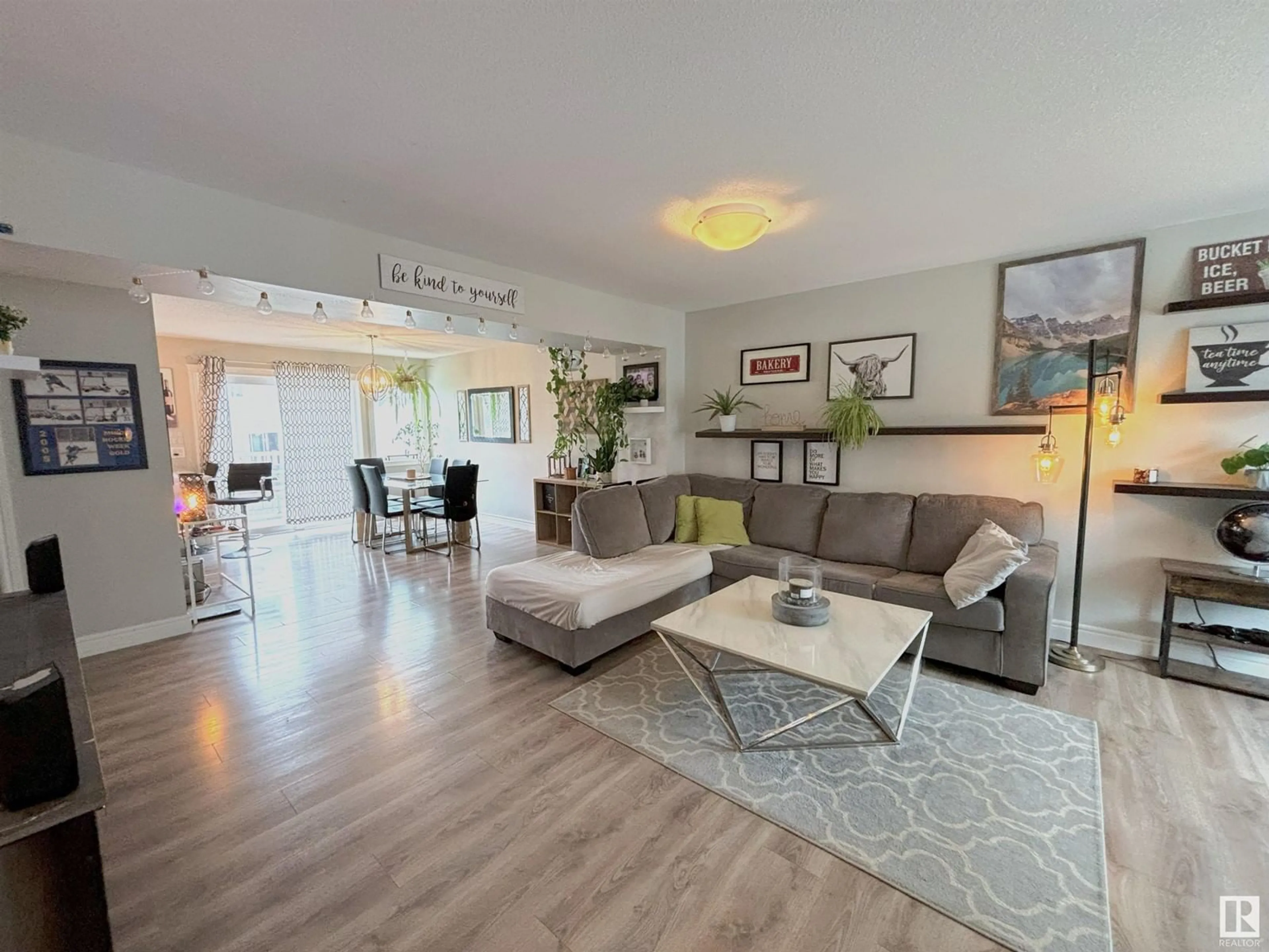 Living room with furniture, wood/laminate floor for #43 - 1391 STARLING DR, Edmonton Alberta T5S0L3