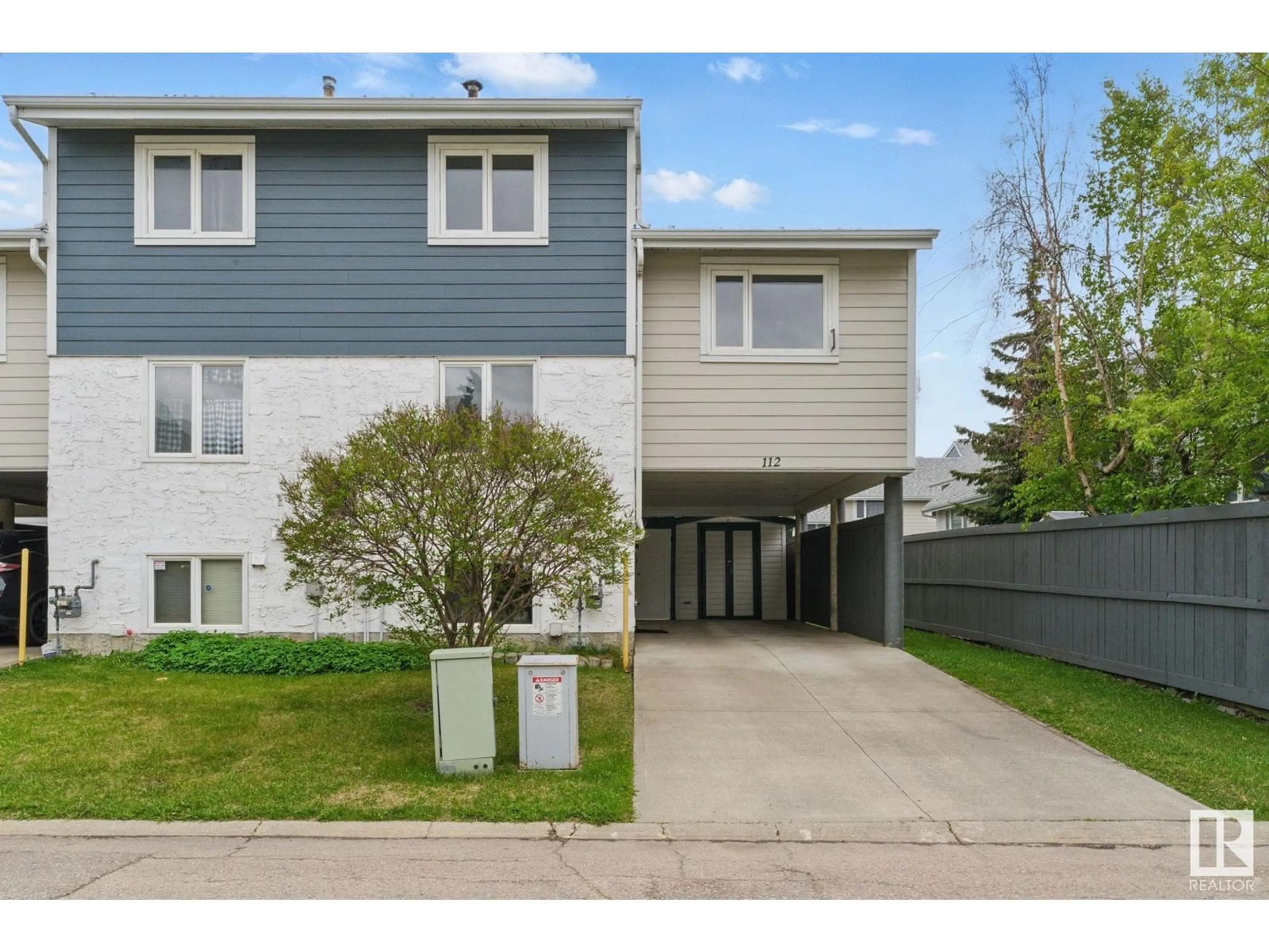 Home with vinyl exterior material, street for TWO - 112 CALLINGWOOD NW, Edmonton Alberta T5T1A3