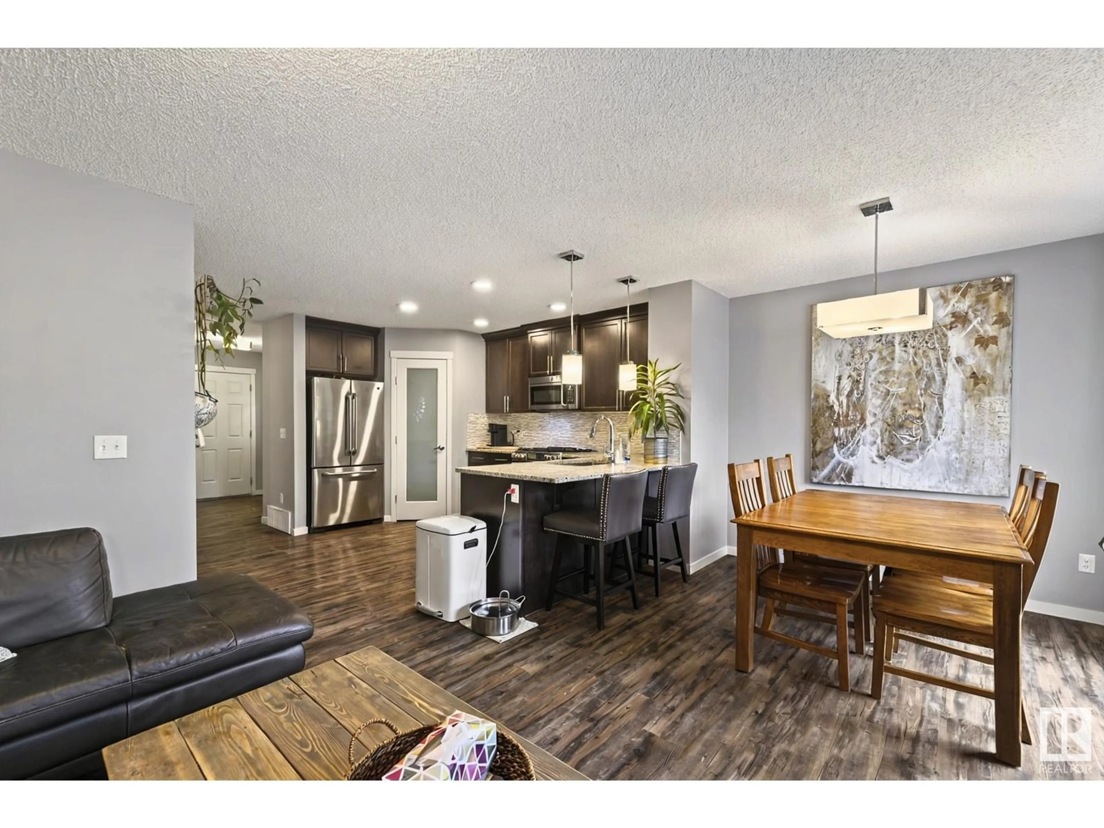 Open concept kitchen, wood/laminate floor for 17417 120 ST, Edmonton Alberta T5X0K6