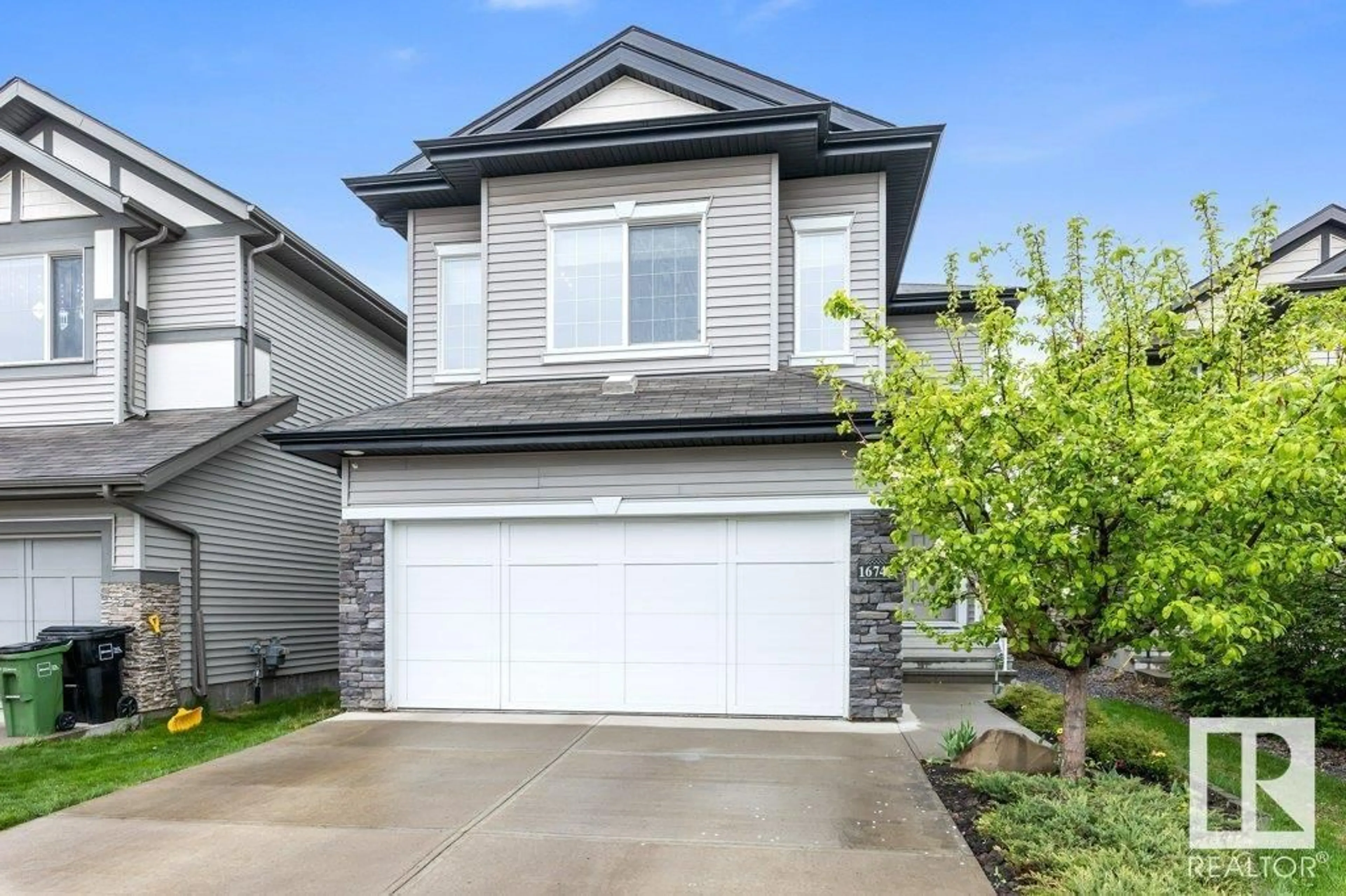 Home with vinyl exterior material, street for NW - 16742 122A ST, Edmonton Alberta T5X0G3