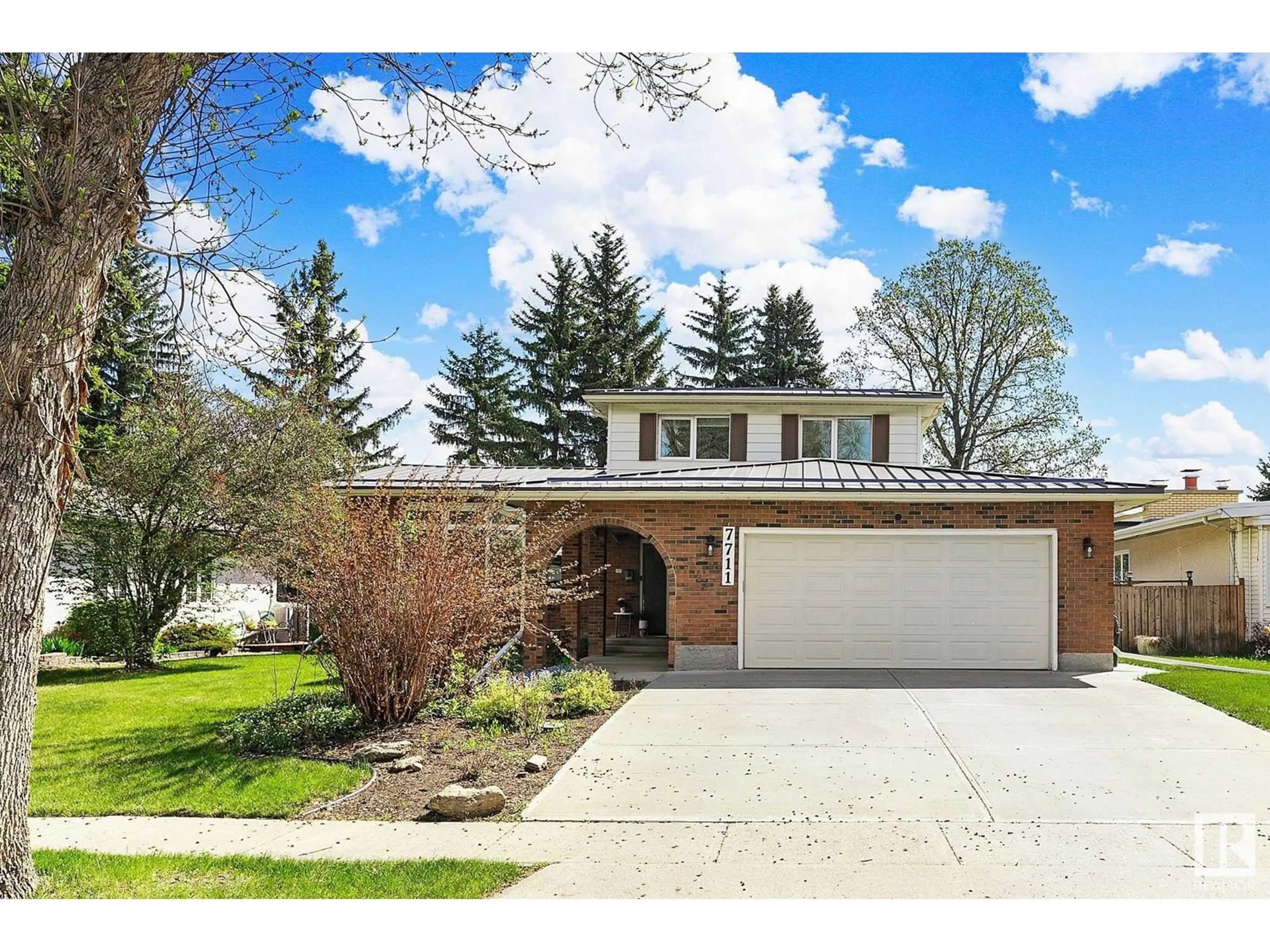 Home with brick exterior material, street for NW - 7711 154A ST, Edmonton Alberta T5R1V3