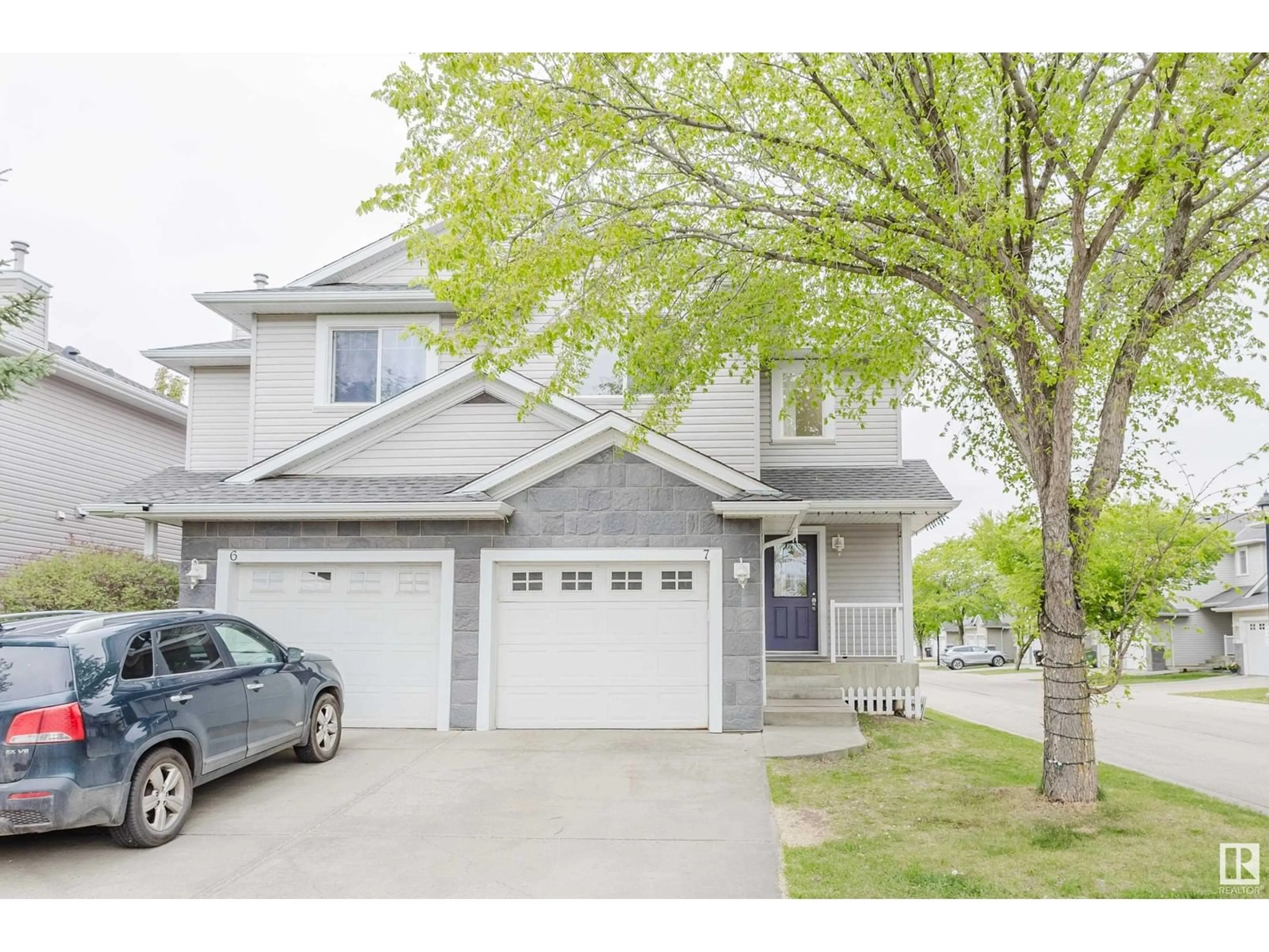 Home with vinyl exterior material, street for #7 - 1428 HODGSON WY, Edmonton Alberta T6R3P8