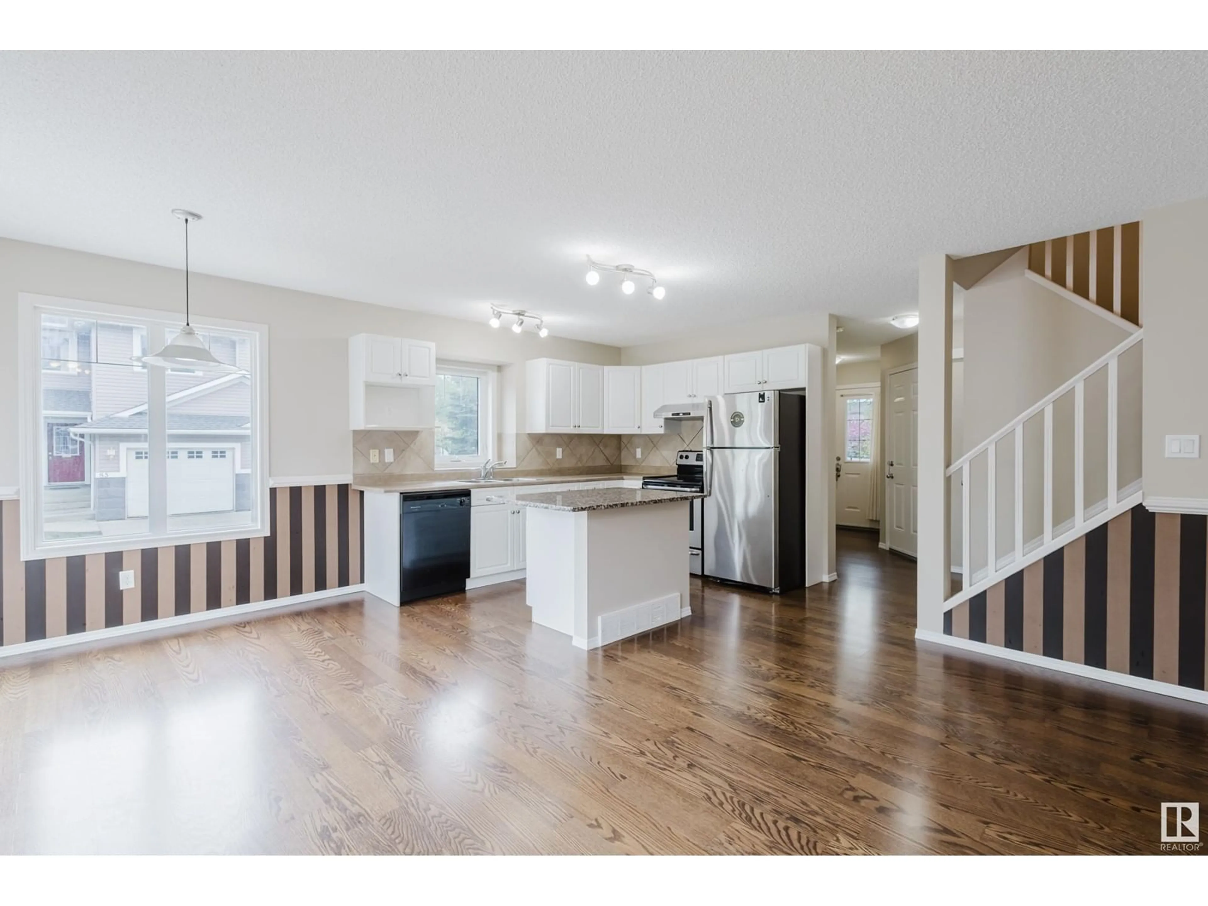 Open concept kitchen, wood/laminate floor for #7 - 1428 HODGSON WY, Edmonton Alberta T6R3P8