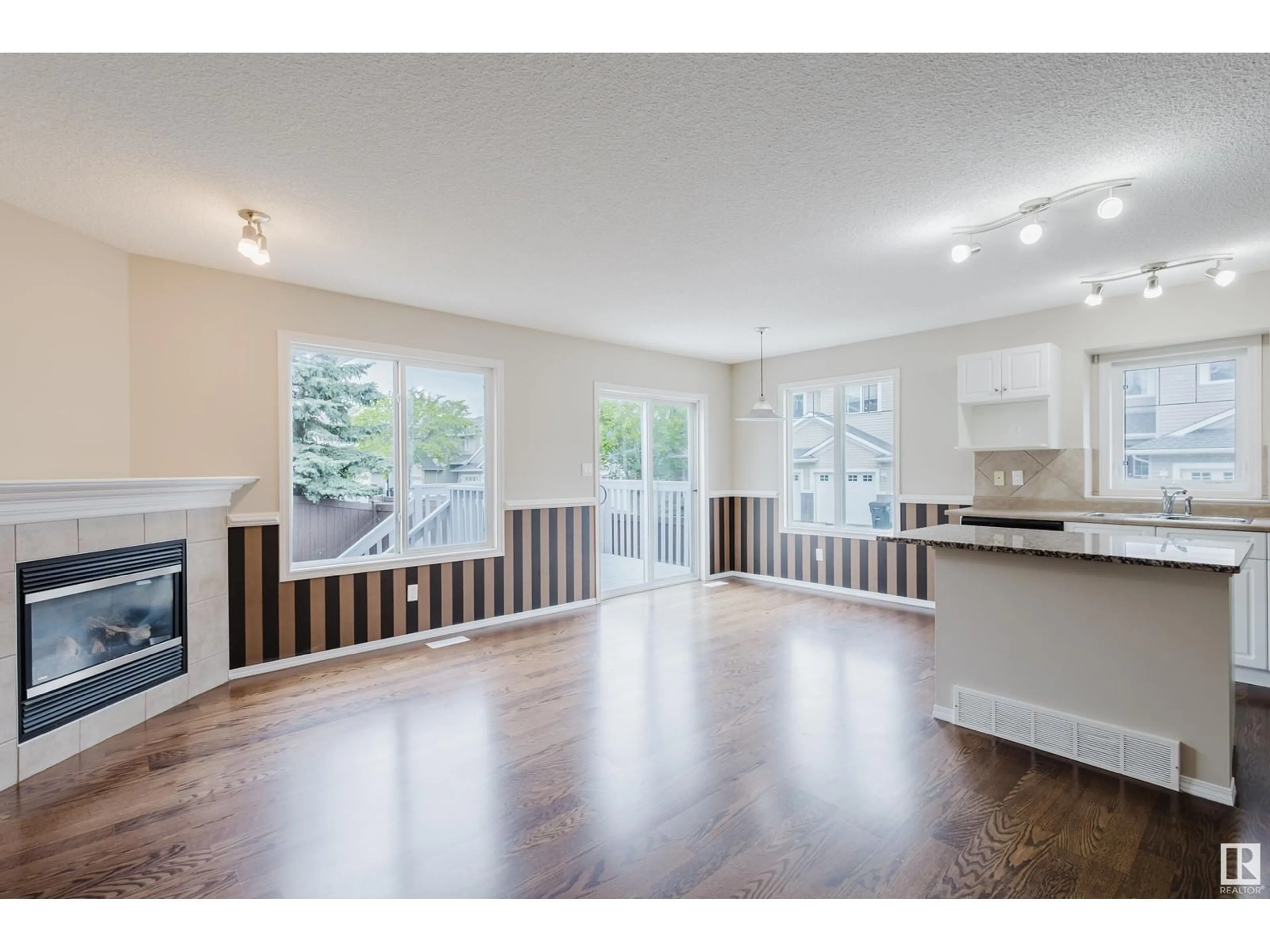 Open concept kitchen, wood/laminate floor for #7 - 1428 HODGSON WY, Edmonton Alberta T6R3P8