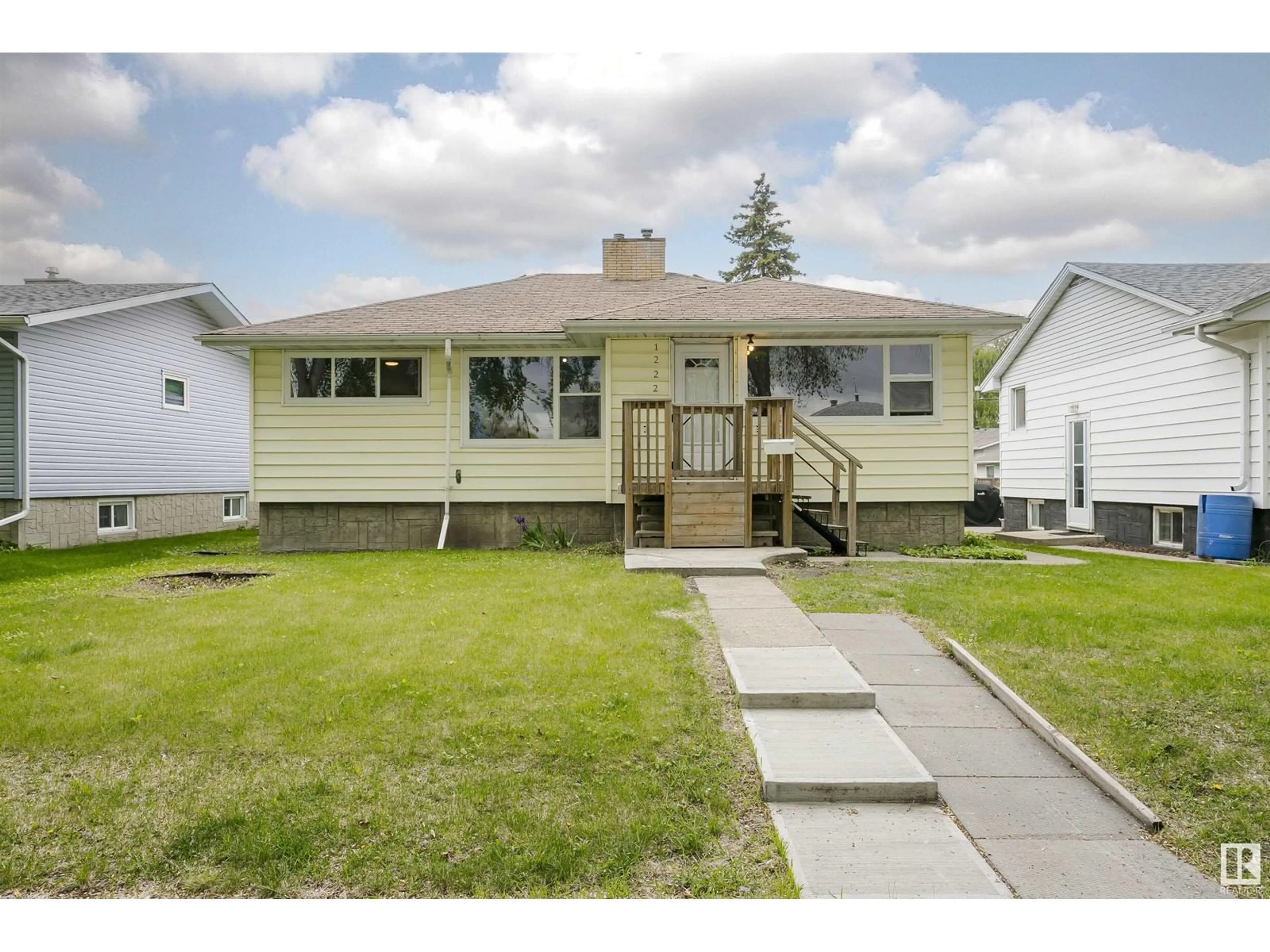 Home with vinyl exterior material, street for 12220 51 ST, Edmonton Alberta T5W3H2