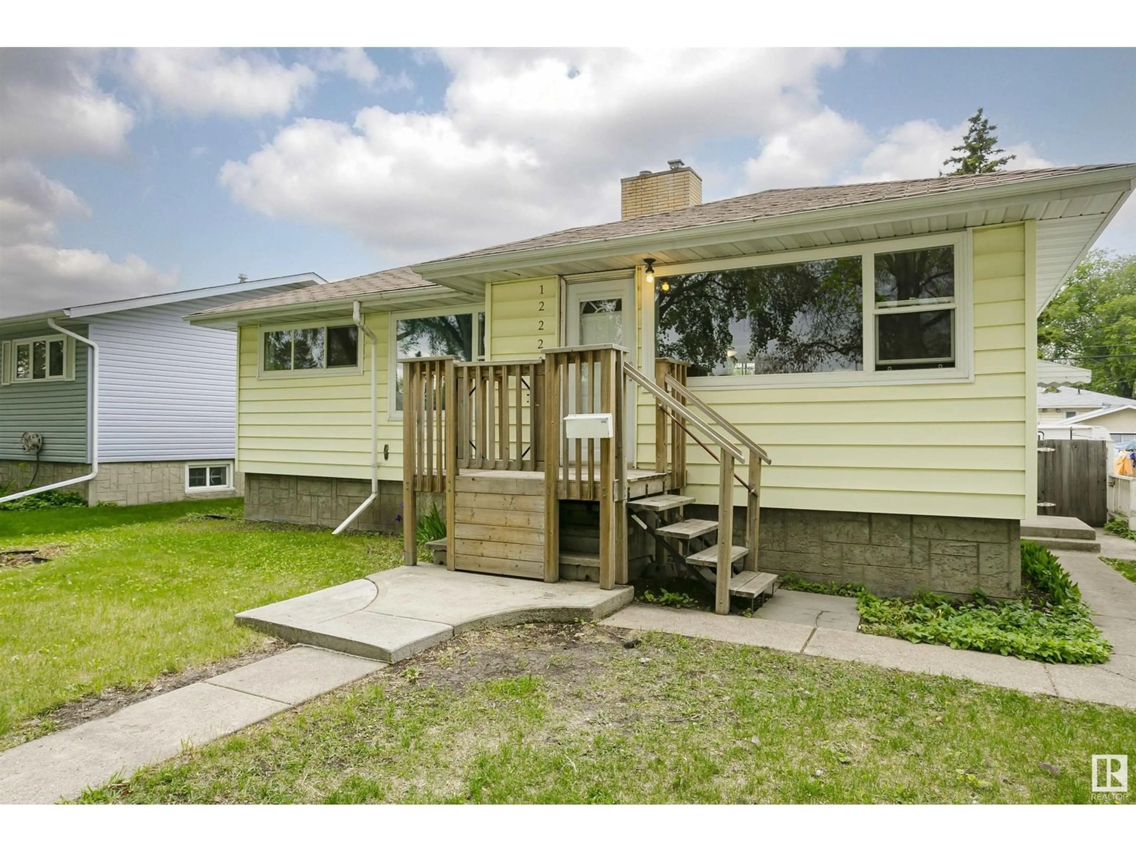 Home with vinyl exterior material, street for 12220 51 ST, Edmonton Alberta T5W3H2