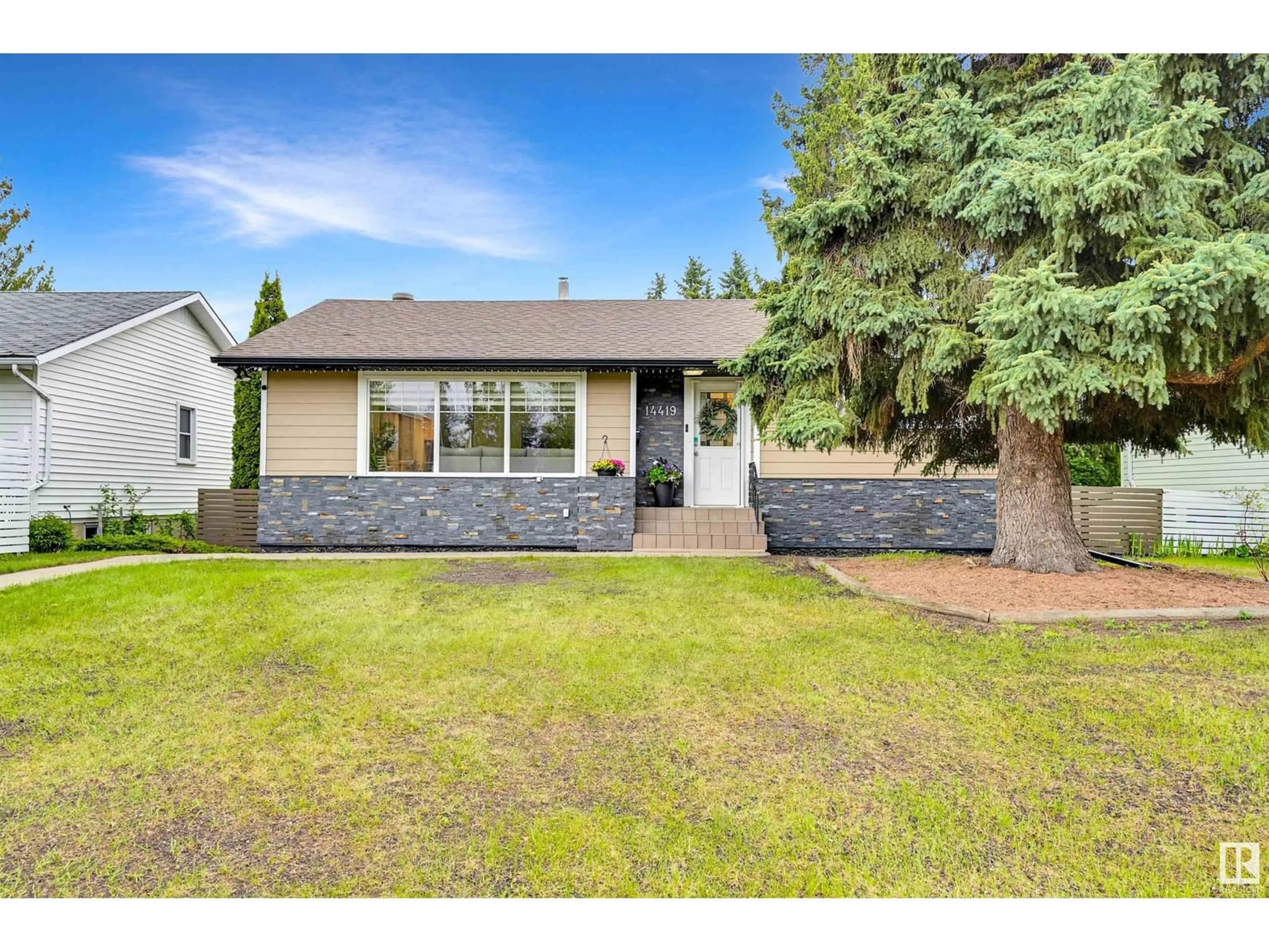 Home with vinyl exterior material, street for 14419 96 AV, Edmonton Alberta T5N0C6