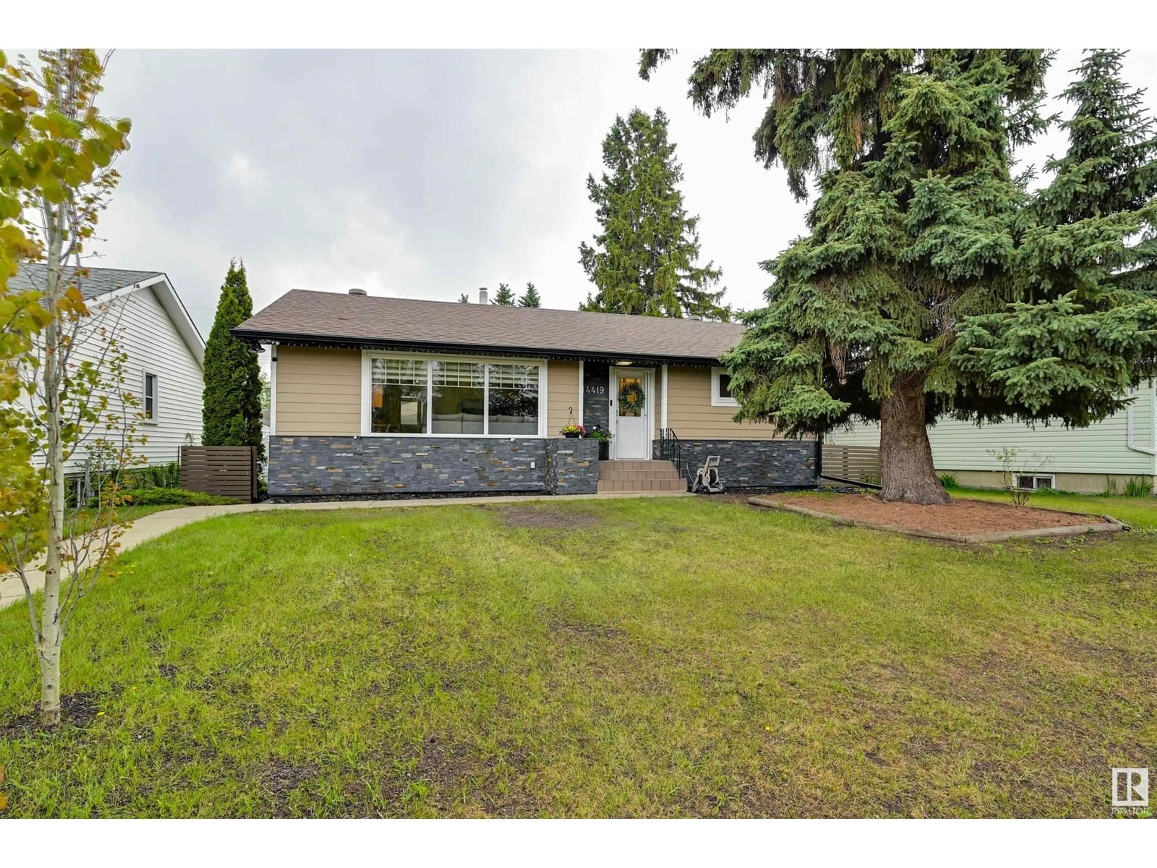 Home with vinyl exterior material, street for 14419 96 AV, Edmonton Alberta T5N0C6