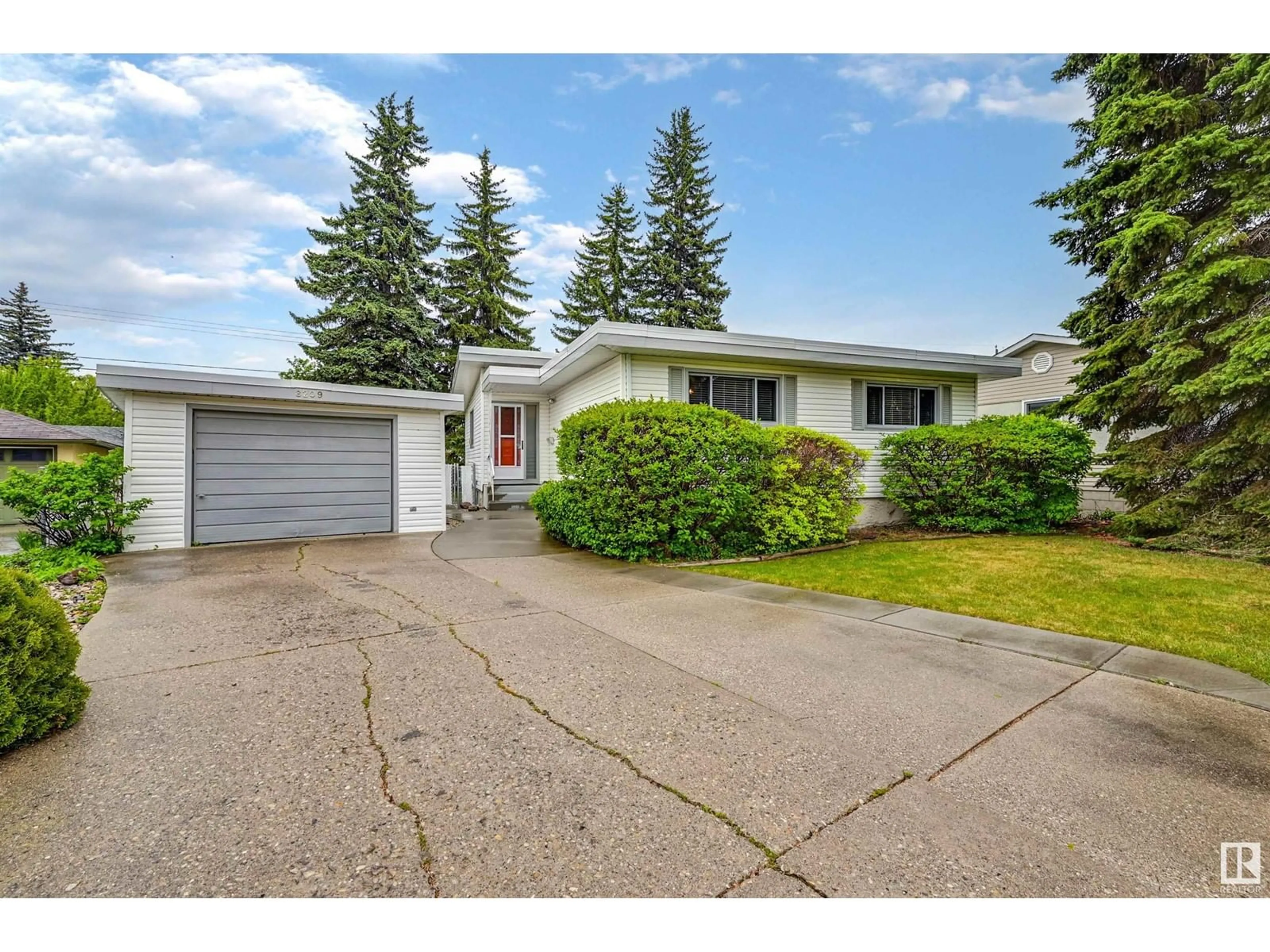 Home with vinyl exterior material, street for NW - 8209 150 ST, Edmonton Alberta T5R1C9