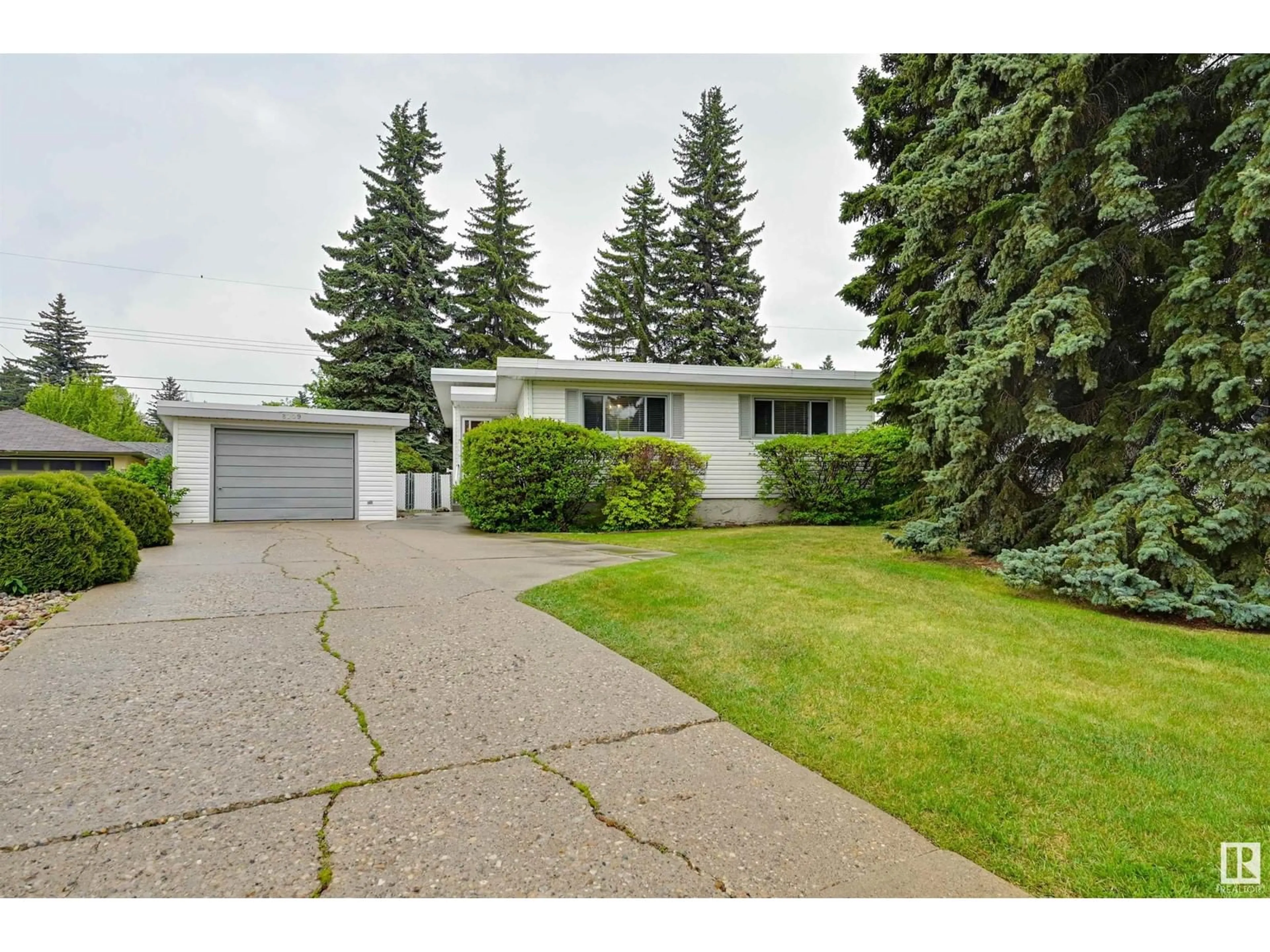 Home with vinyl exterior material, street for NW - 8209 150 ST, Edmonton Alberta T5R1C9
