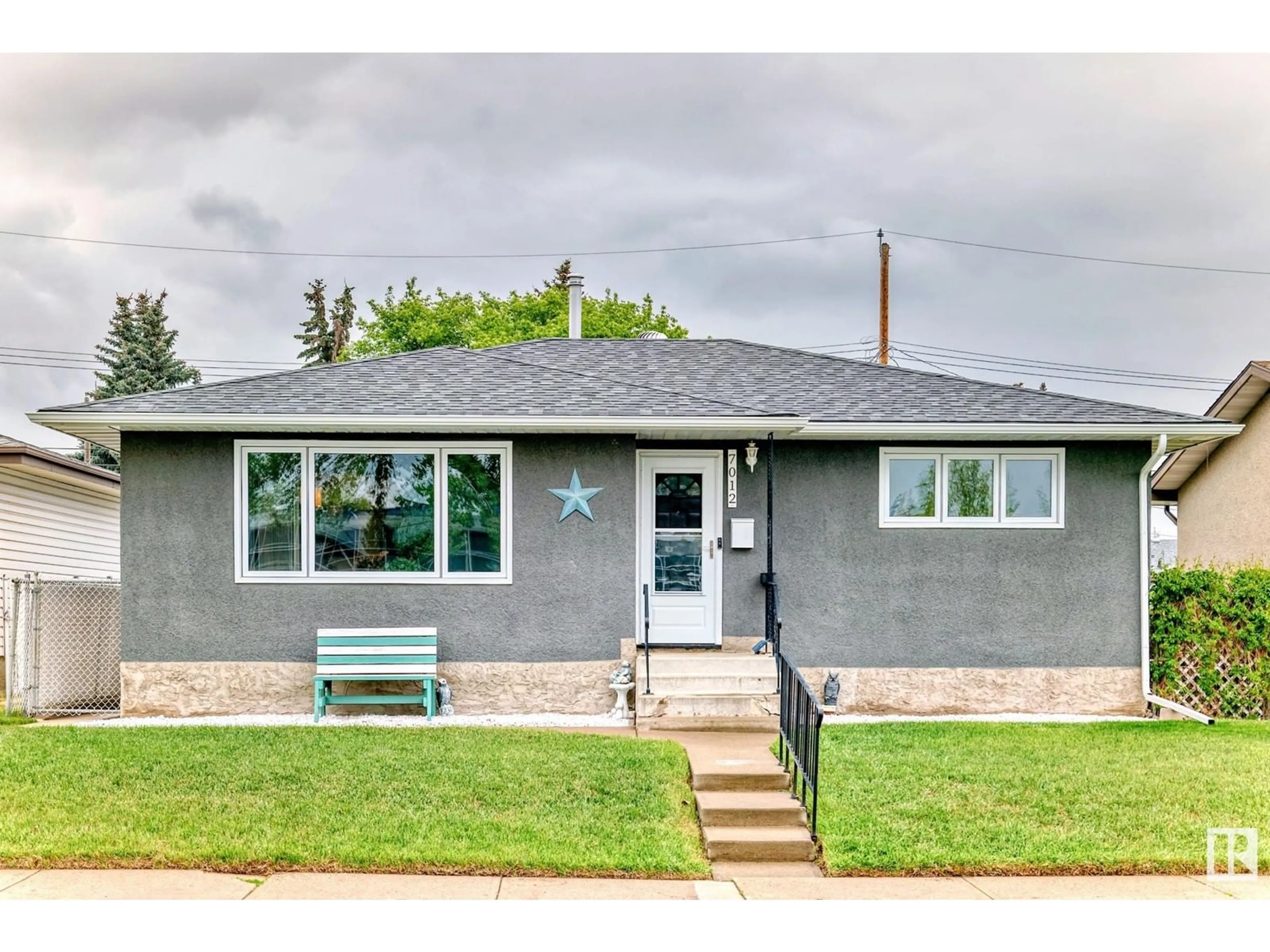 Home with vinyl exterior material, street for 7012 132 AV, Edmonton Alberta T5C2A6