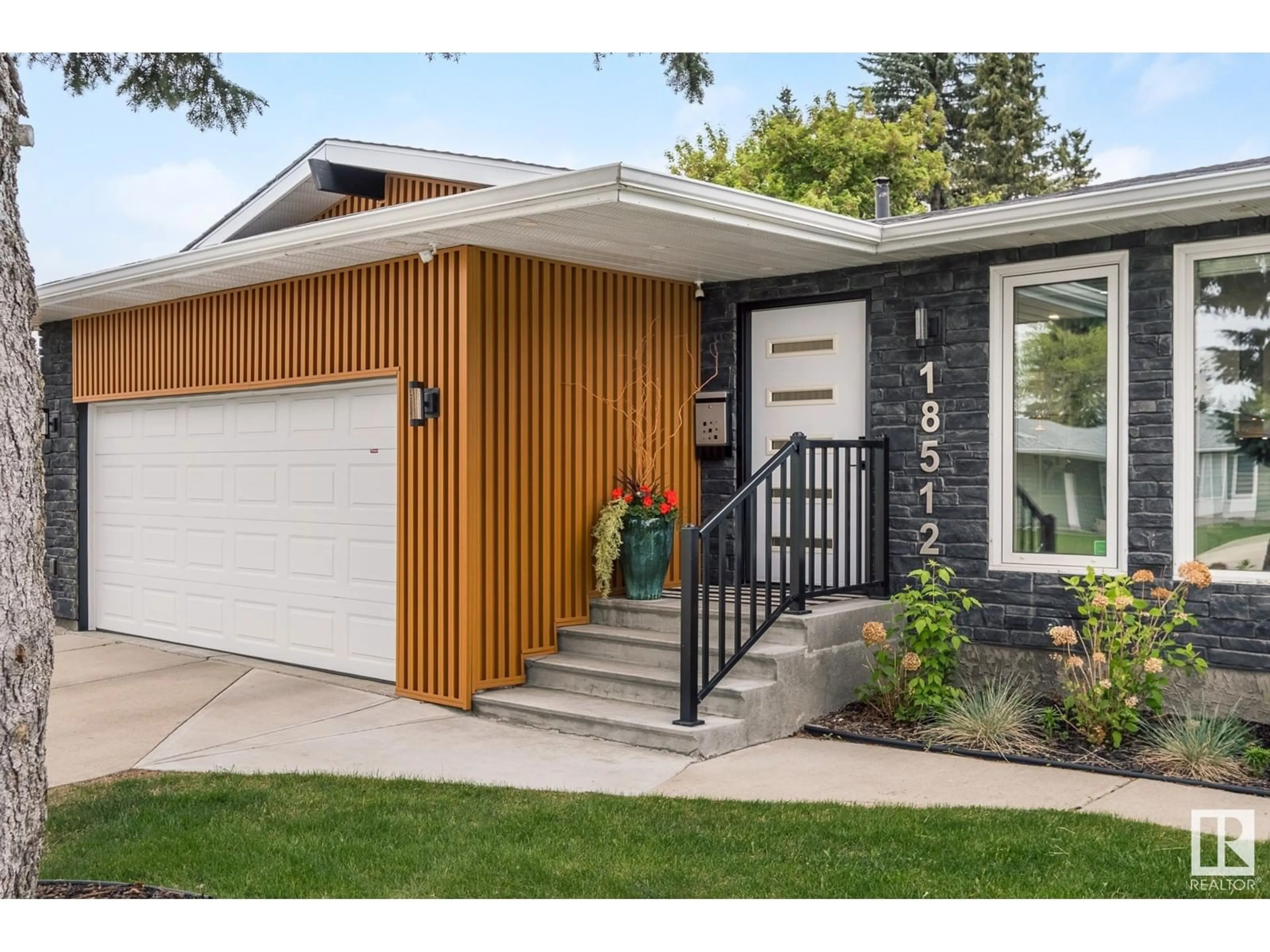 Home with vinyl exterior material, street for 18512 90 AV, Edmonton Alberta T5T1N7