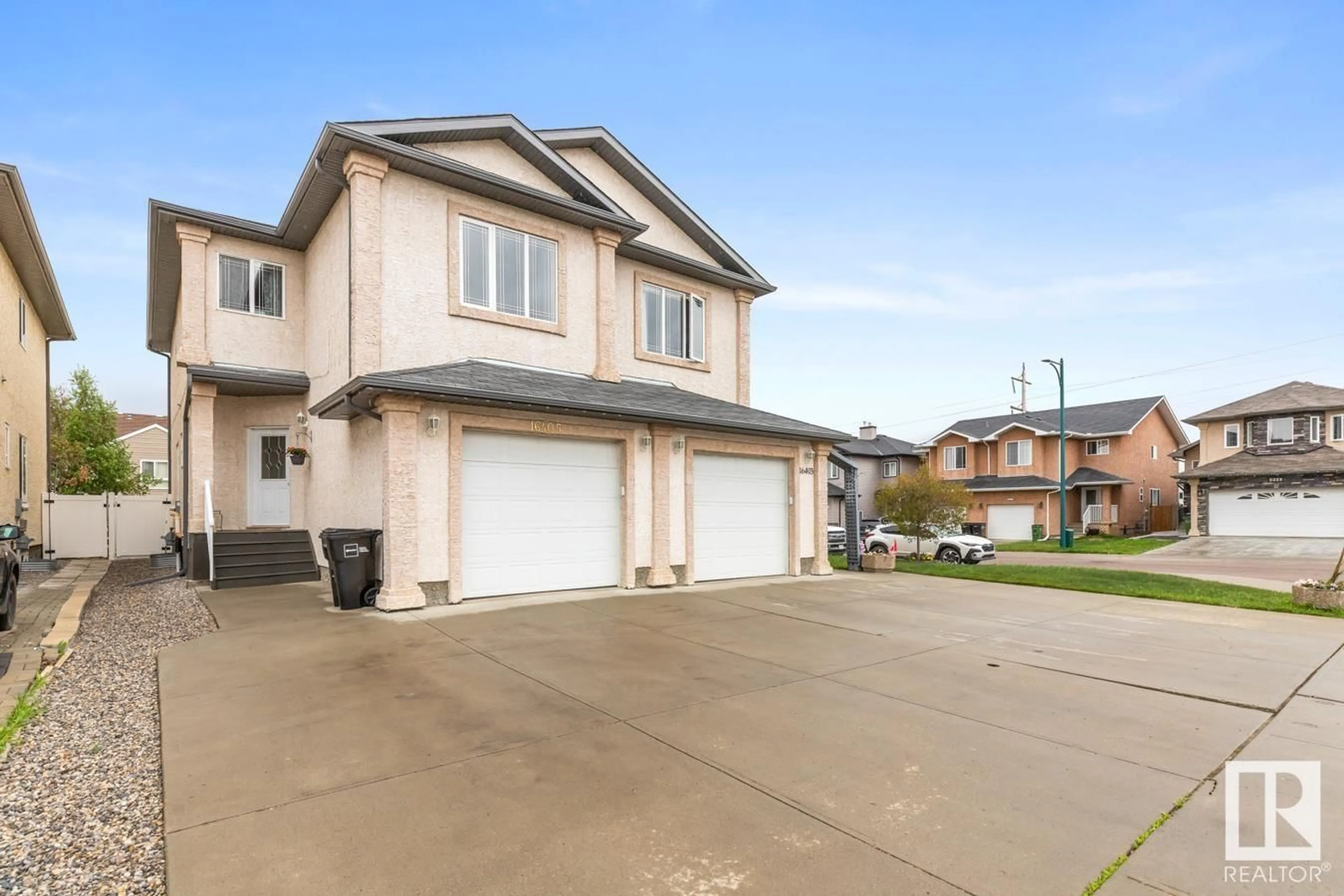 Home with vinyl exterior material, street for 16405 53 ST, Edmonton Alberta T5Y0H5