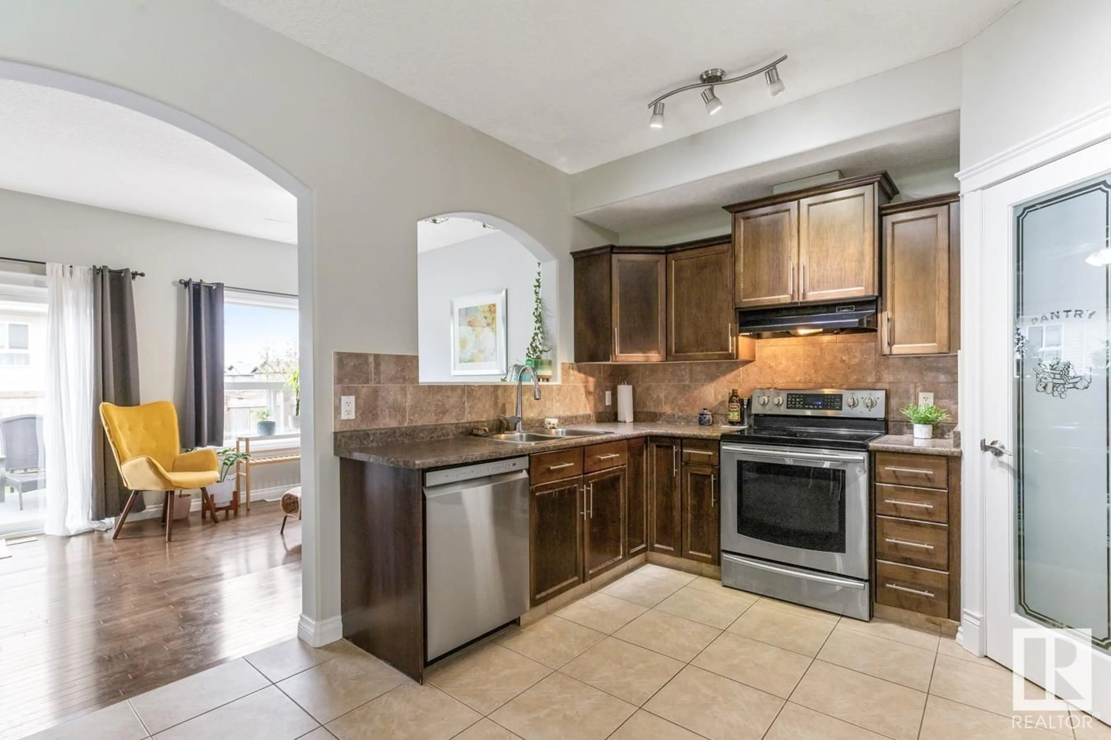 Open concept kitchen, ceramic/tile floor for 16405 53 ST, Edmonton Alberta T5Y0H5