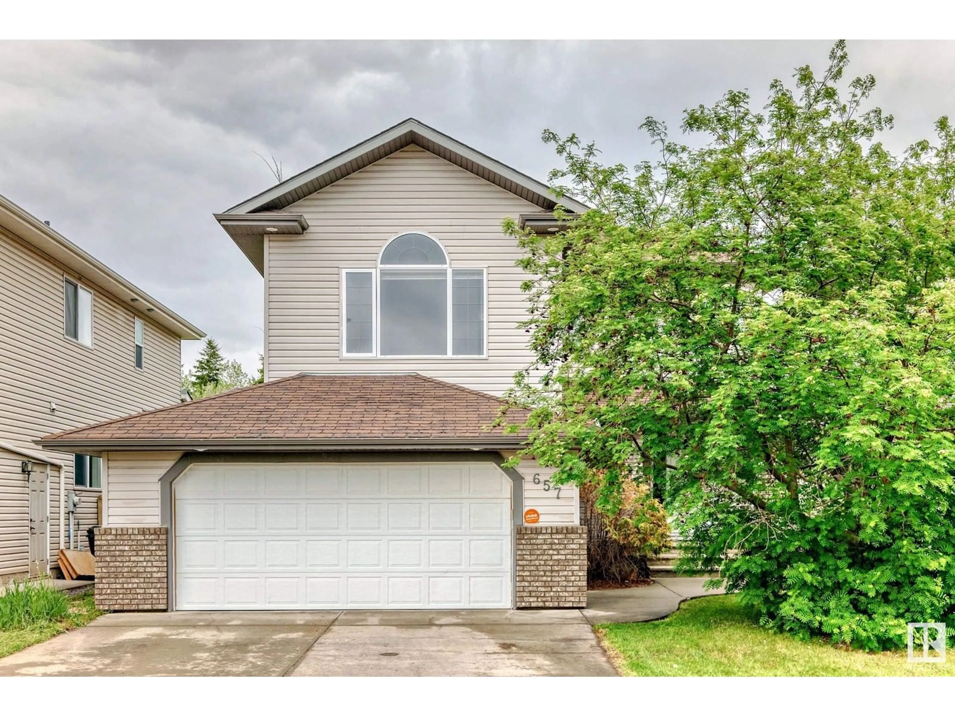 Home with vinyl exterior material, street for 657 SILVER BERRY RD, Edmonton Alberta T6T1X7