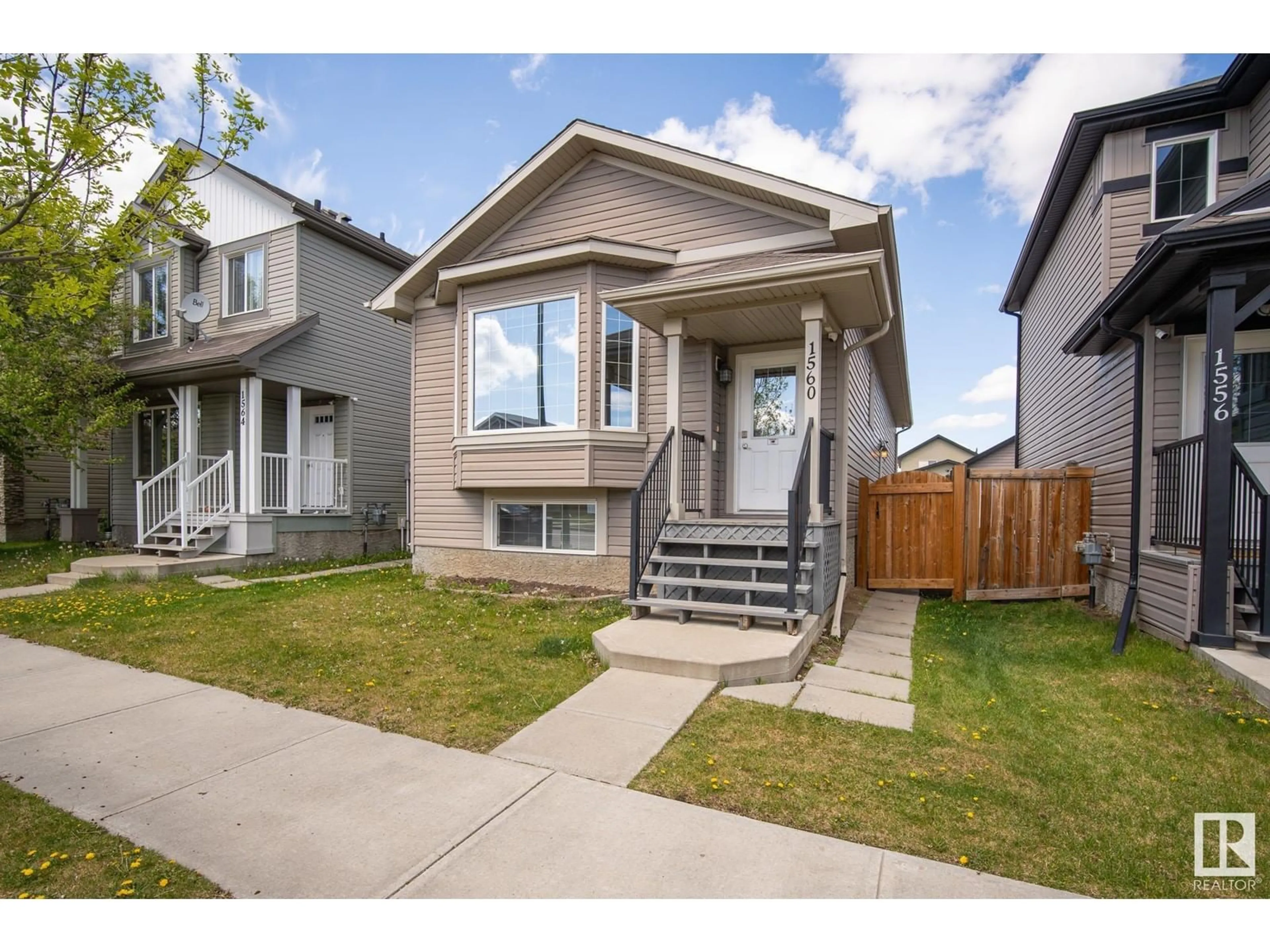 Home with vinyl exterior material, street for 1560 35 AV, Edmonton Alberta T6T0M9