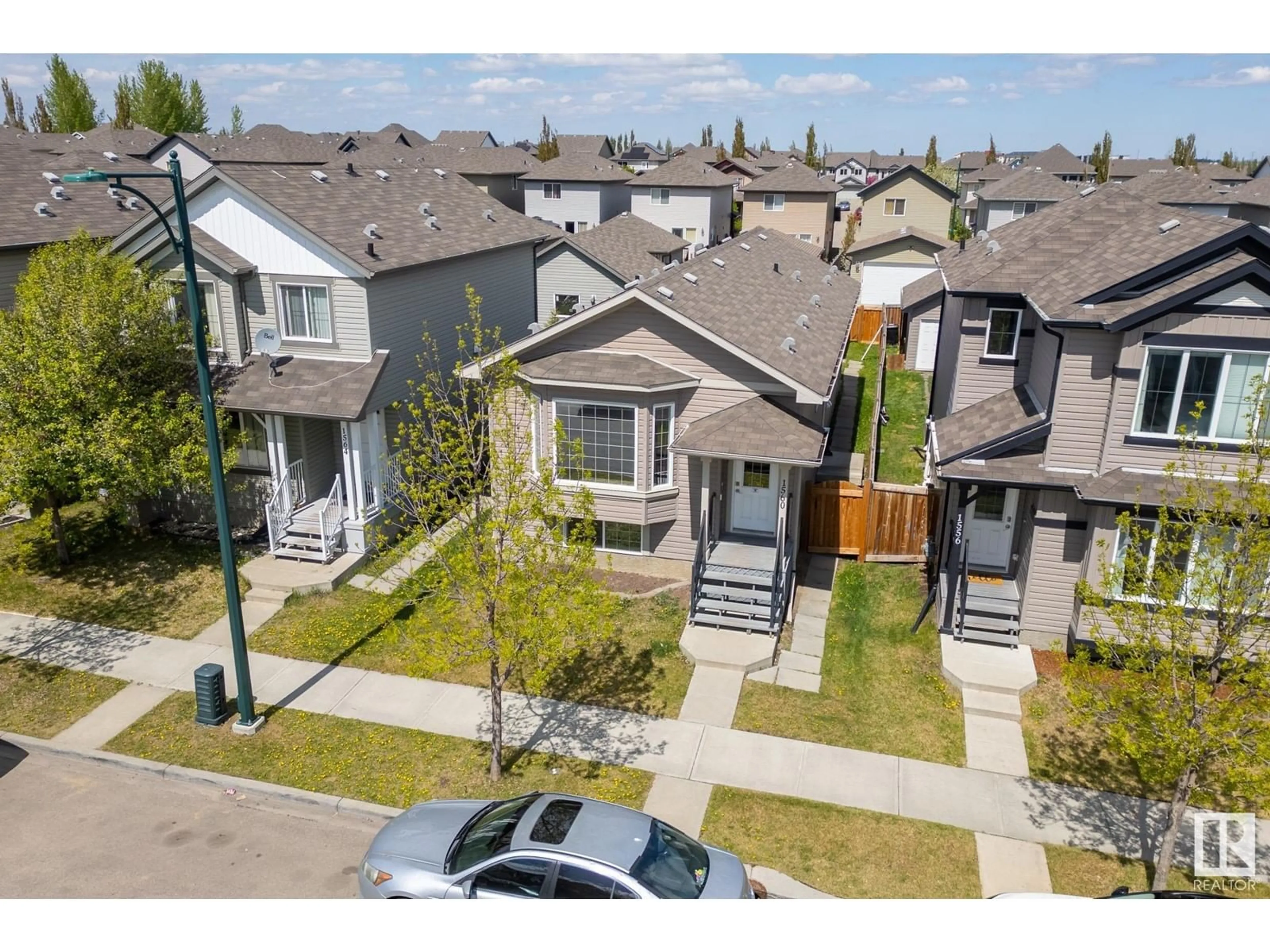 A pic from outside/outdoor area/front of a property/back of a property/a pic from drone, street for 1560 35 AV, Edmonton Alberta T6T0M9