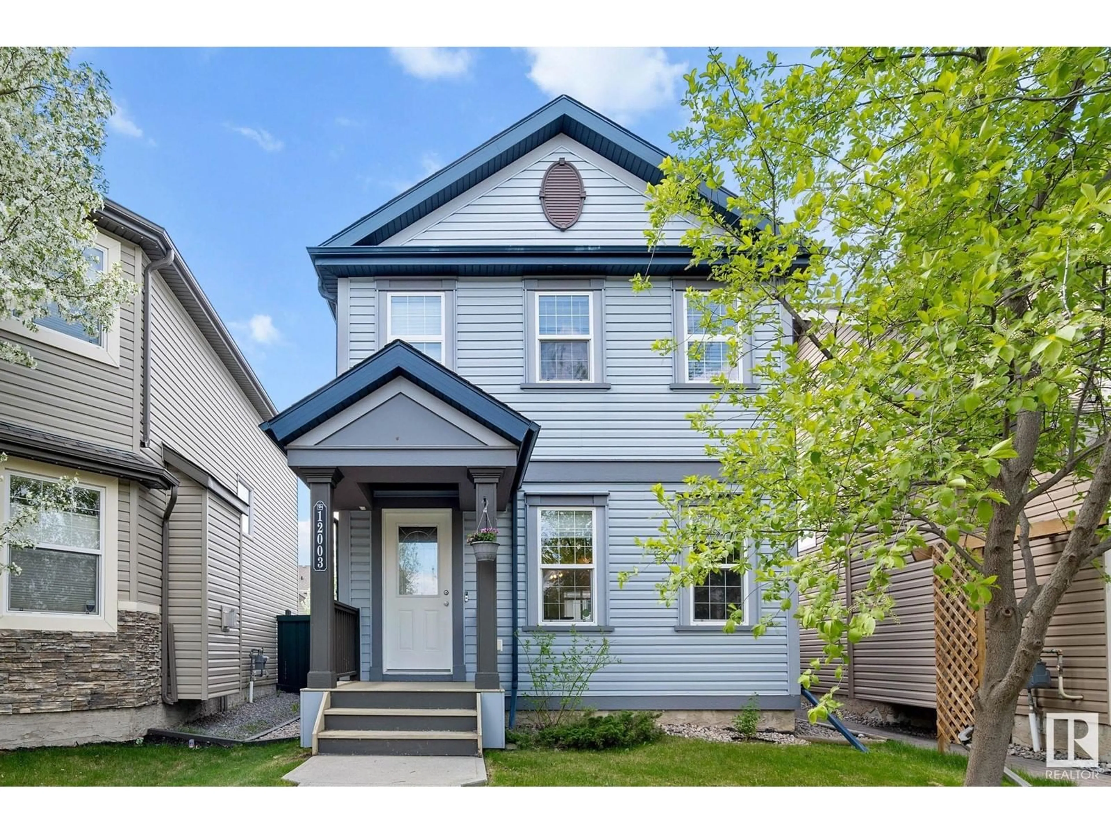 Home with vinyl exterior material, street for 12003 19 AV, Edmonton Alberta T6W1W5
