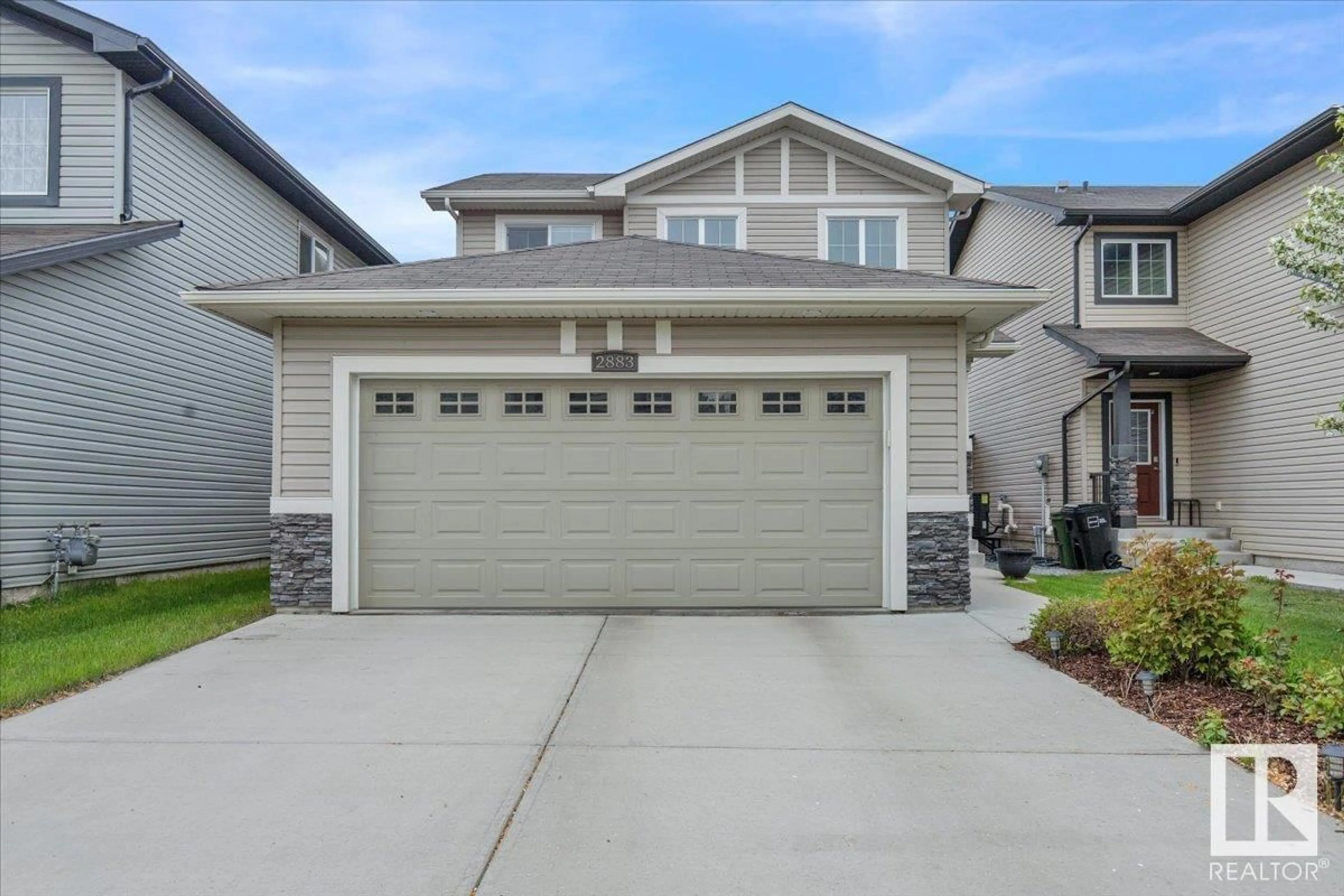 Home with vinyl exterior material, street for 2883 MAPLE WY, Edmonton Alberta T6T0T4