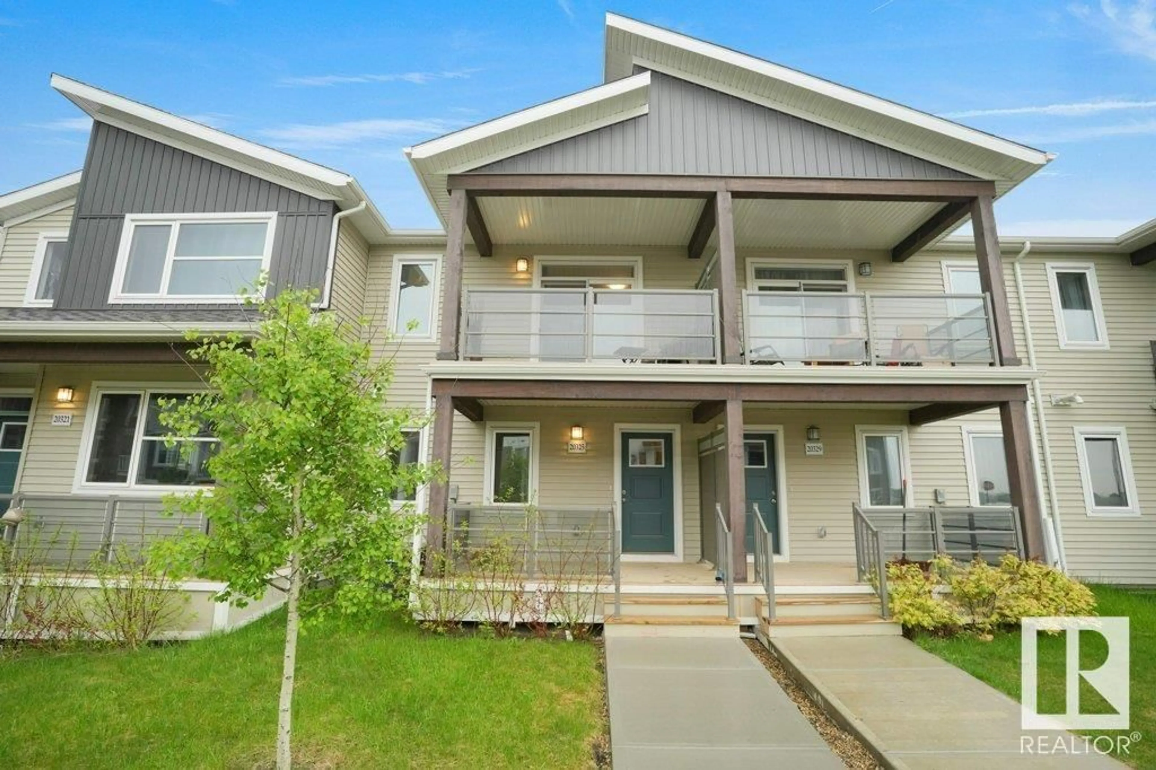 Home with vinyl exterior material, street for 20325 15A AV, Edmonton Alberta T6M1L5