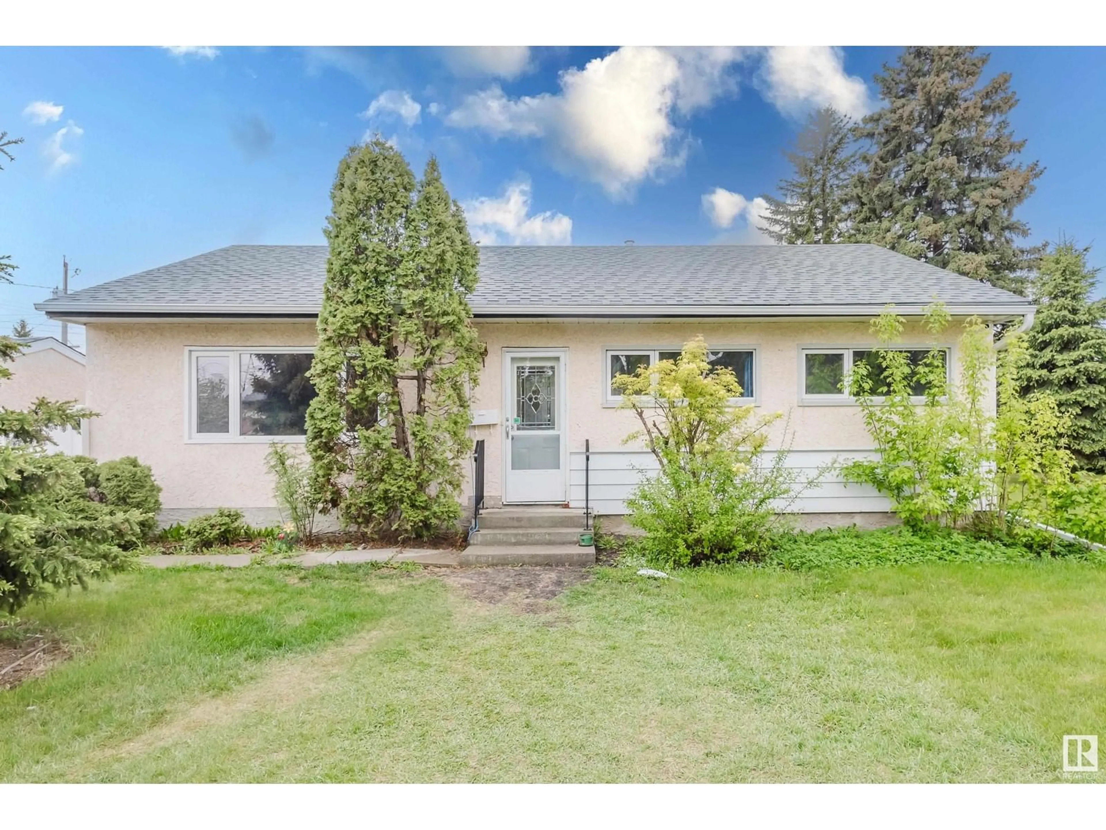 Home with vinyl exterior material, street for NW - 13207 131A AV, Edmonton Alberta T5L3P1