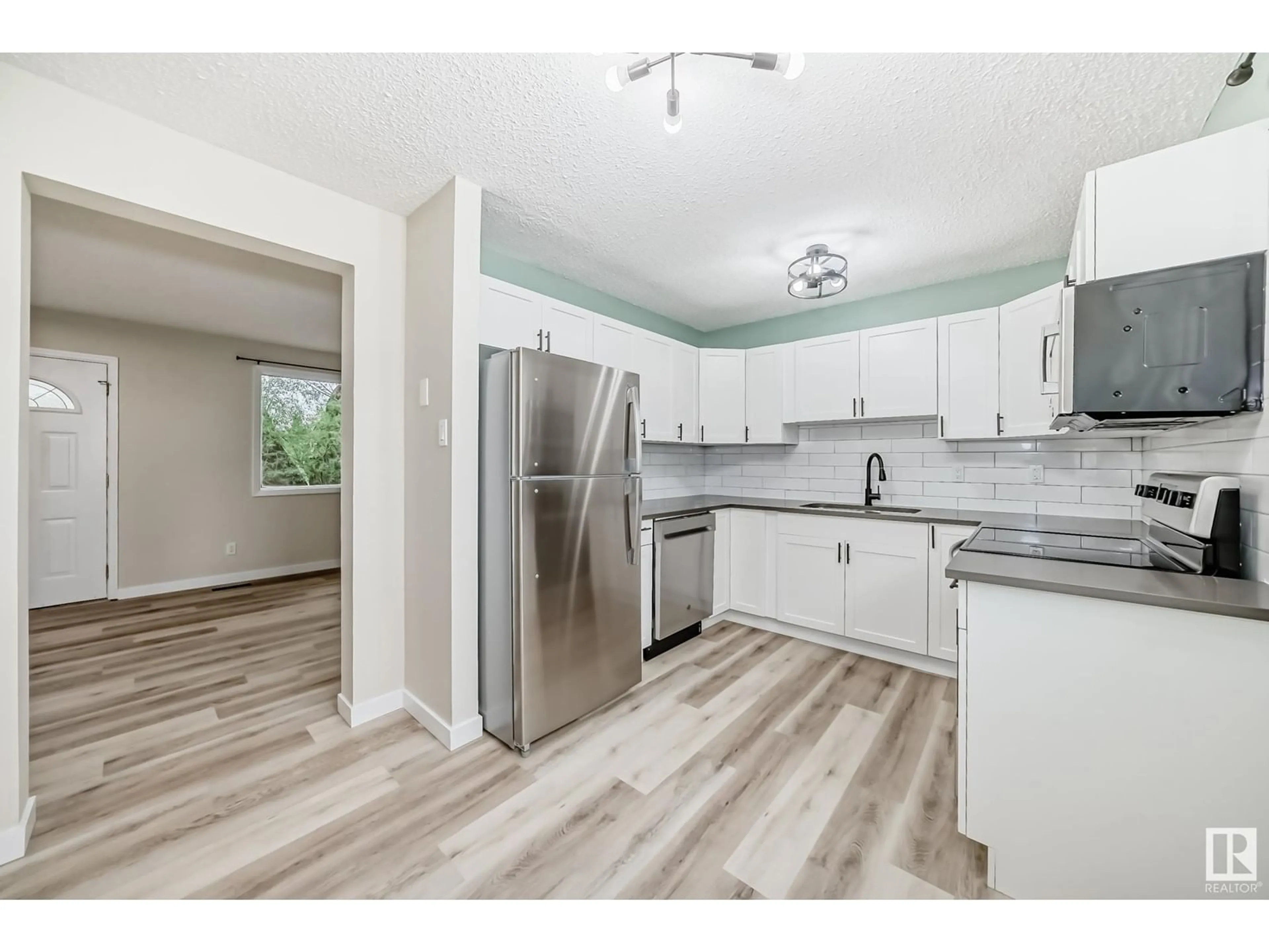 Open concept kitchen, unknown for NW - 1531 KNOTTWOOD N, Edmonton Alberta T6K2B8