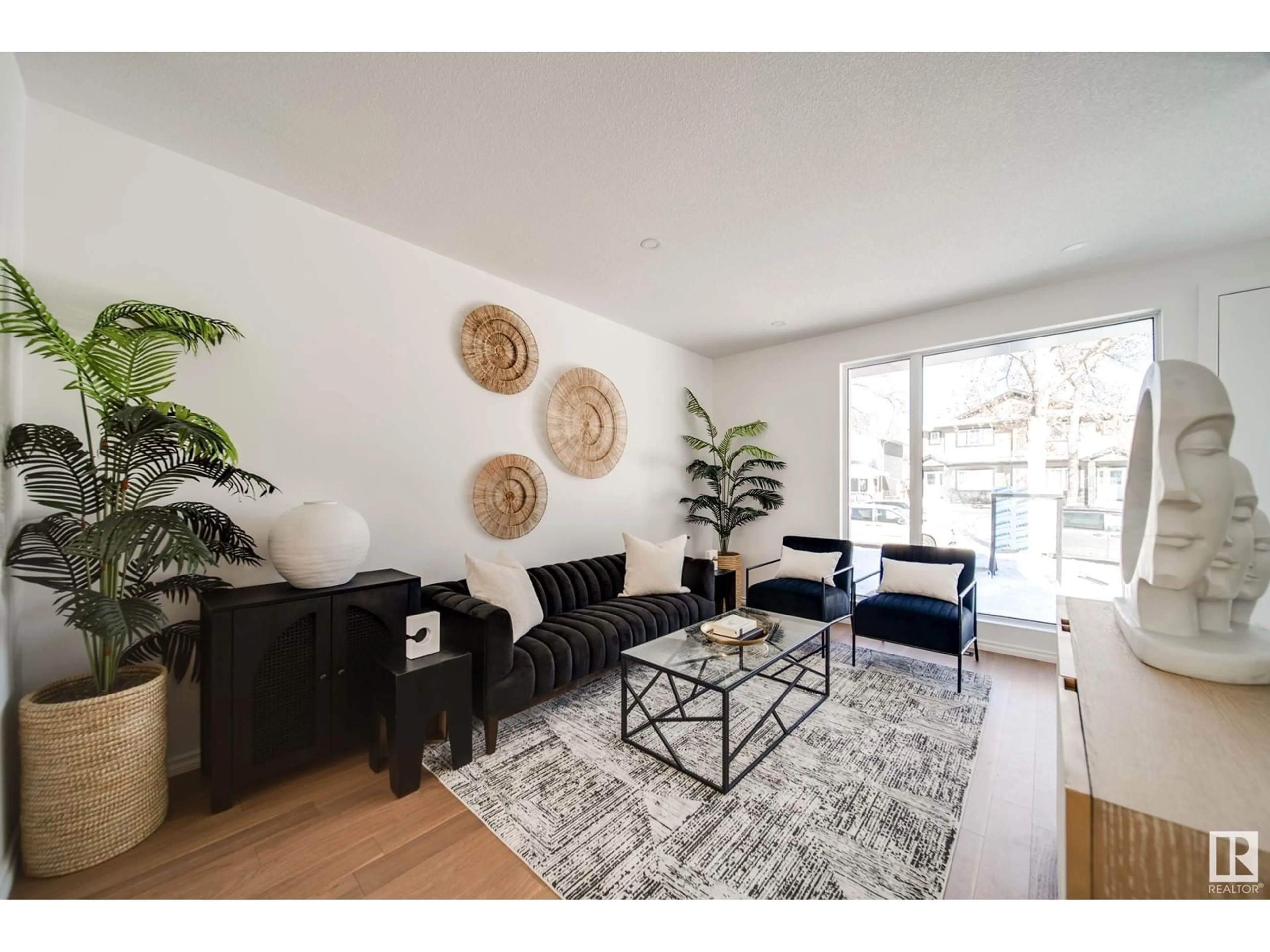 Living room with furniture, wood/laminate floor for 7540 80 AV, Edmonton Alberta T6C0S4