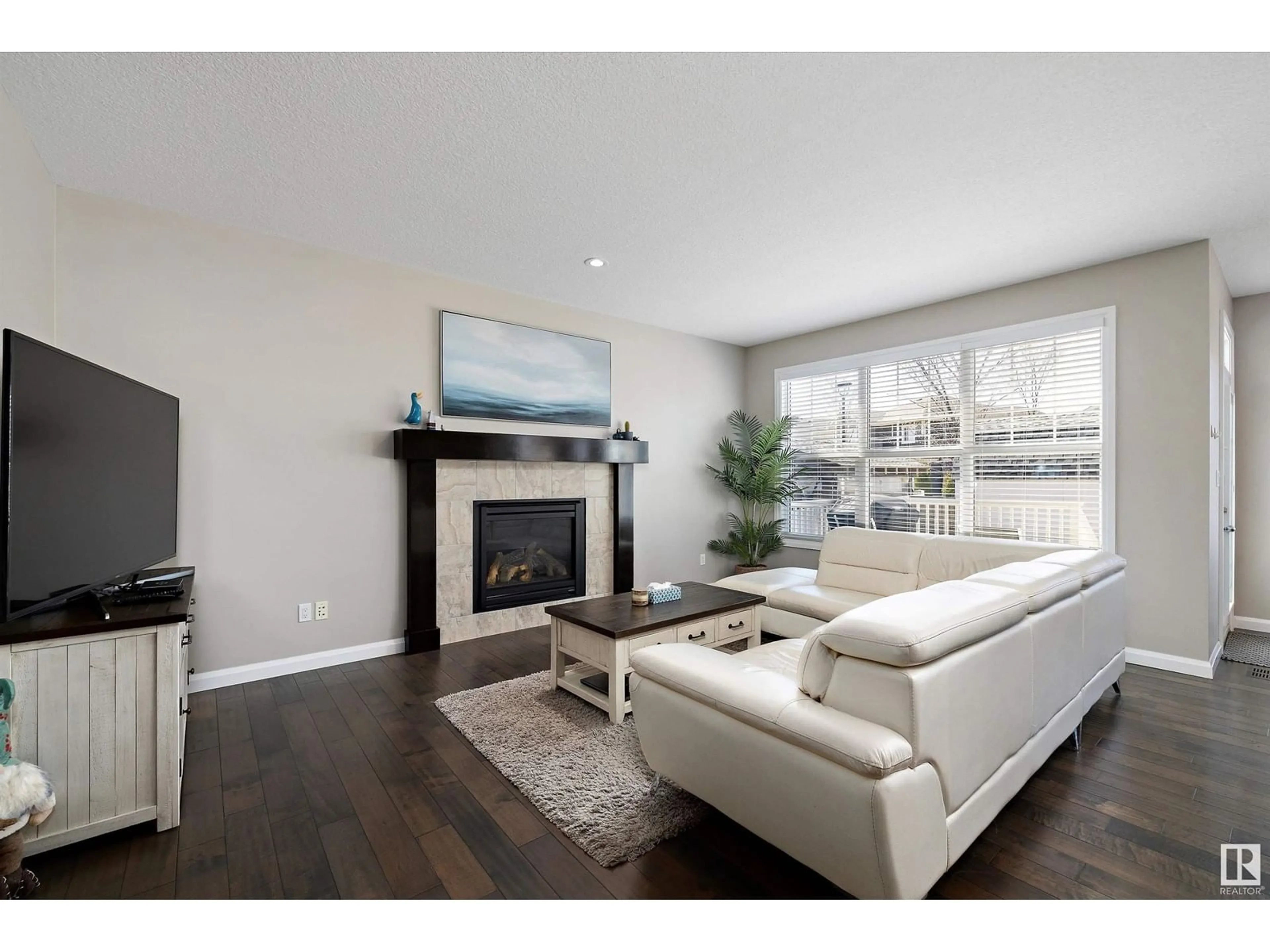 Living room with furniture, wood/laminate floor for SW - 4723 CRABAPPLE RUN RU, Edmonton Alberta T8X0Y7