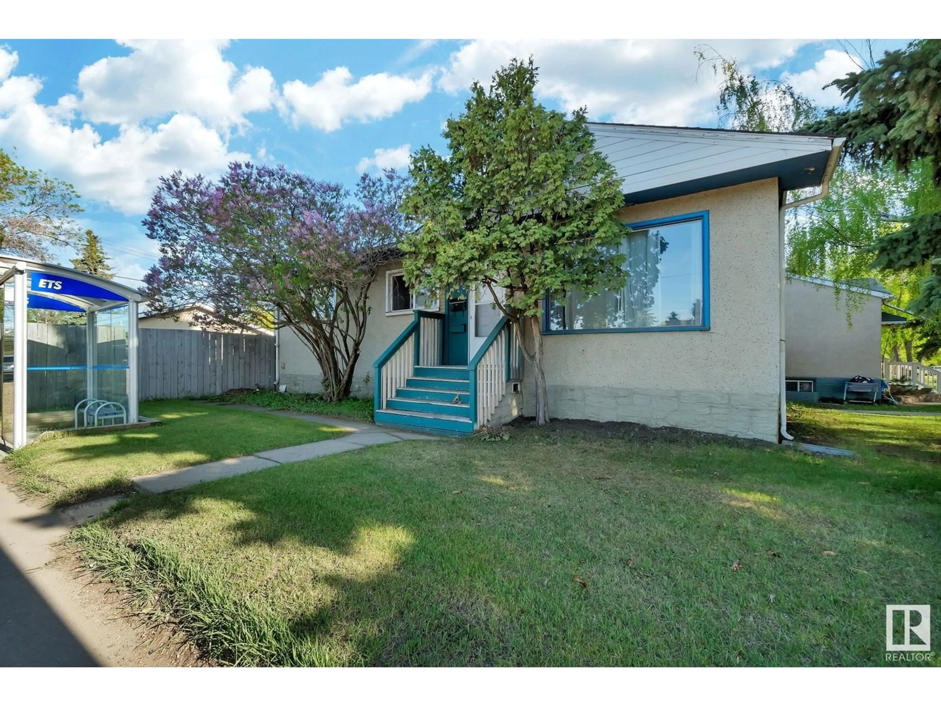 Home with vinyl exterior material, street for 12707 107 AV, Edmonton Alberta T5M1Z7