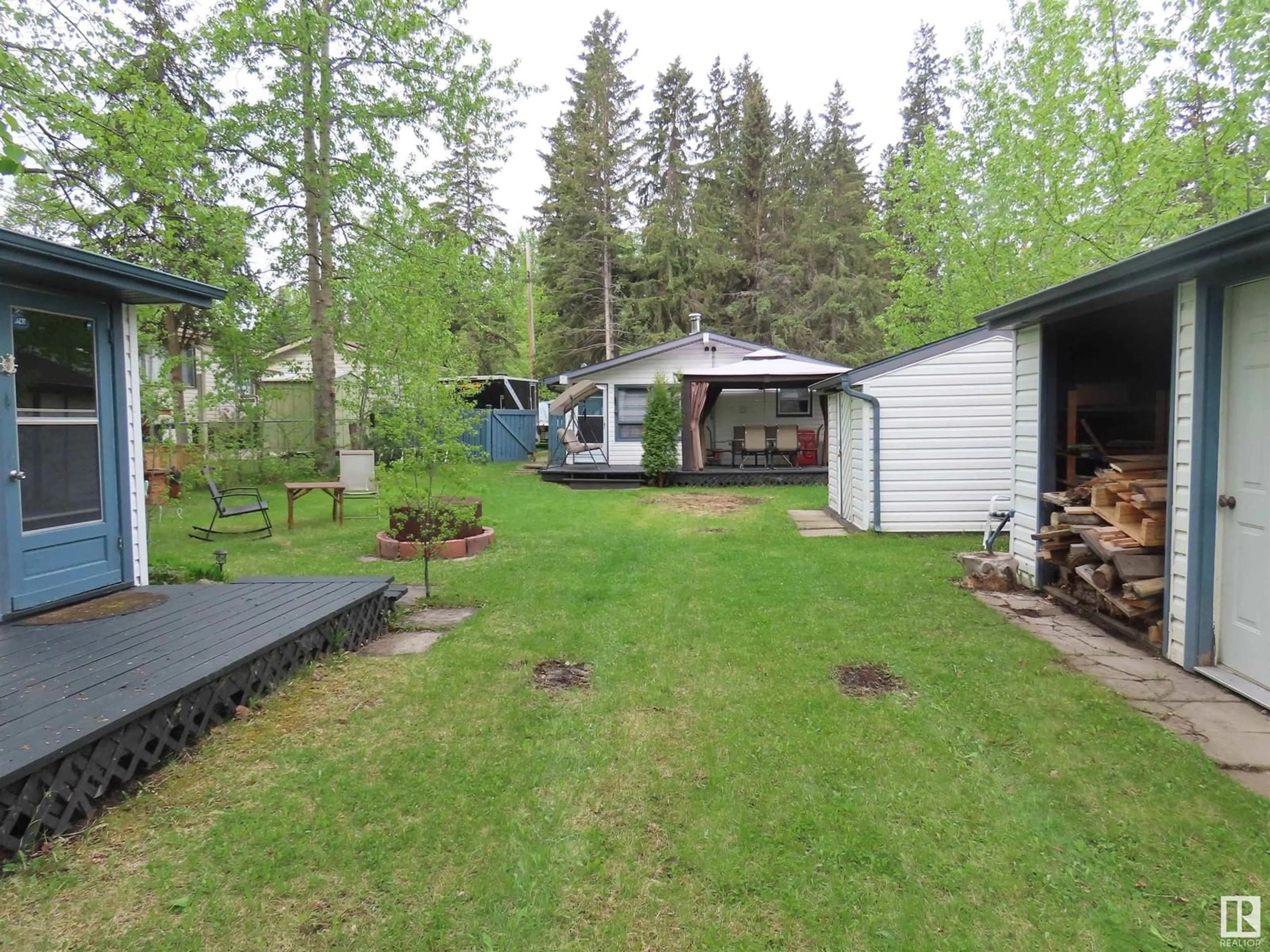 A pic from outside/outdoor area/front of a property/back of a property/a pic from drone, forest/trees view for 216 2ND ST, Rural Lac Ste. Anne County Alberta T0E0A2
