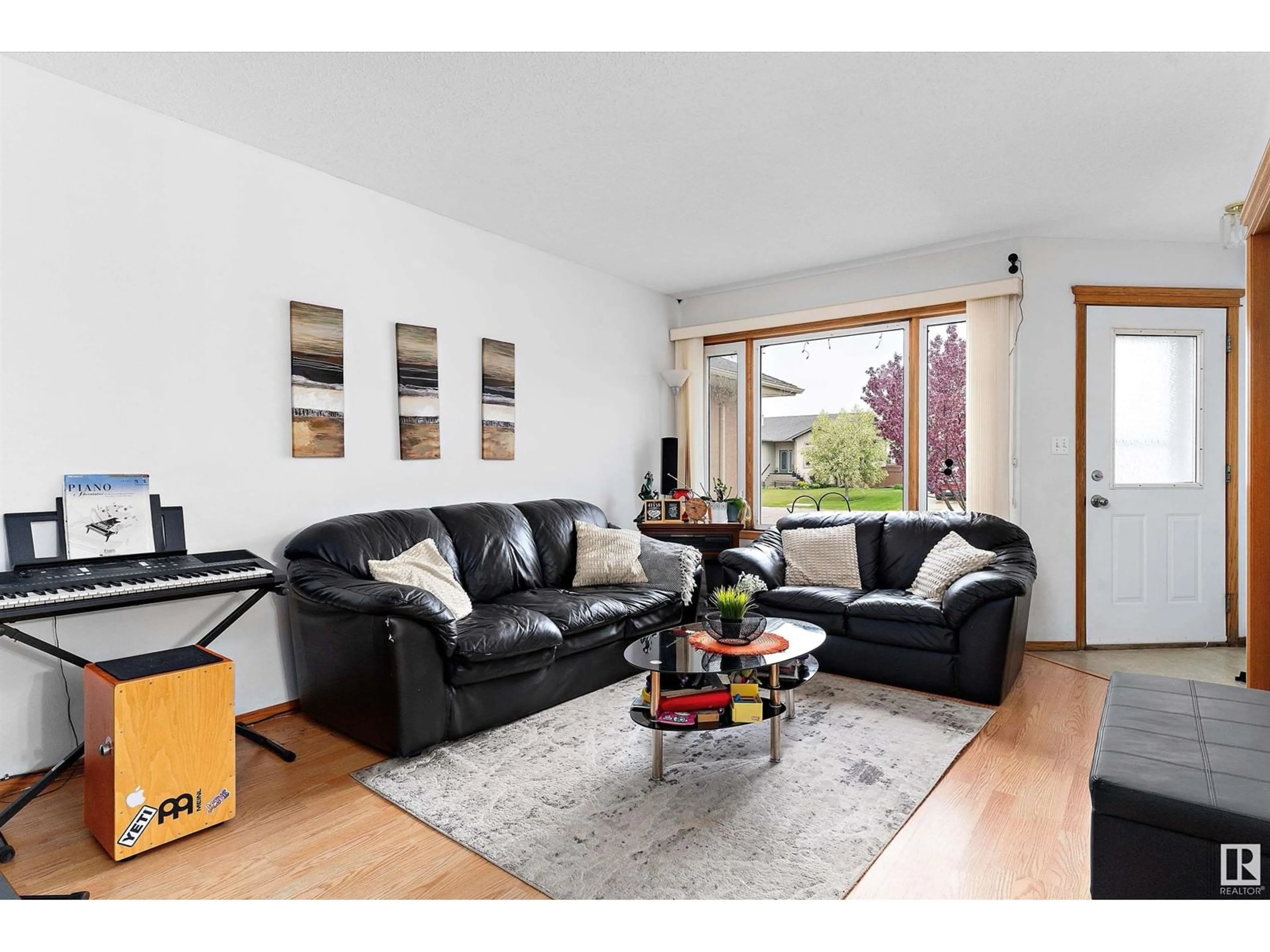 Living room with furniture, wood/laminate floor for 125 PARKSIDE DR, Wetaskiwin Alberta T9A3H1