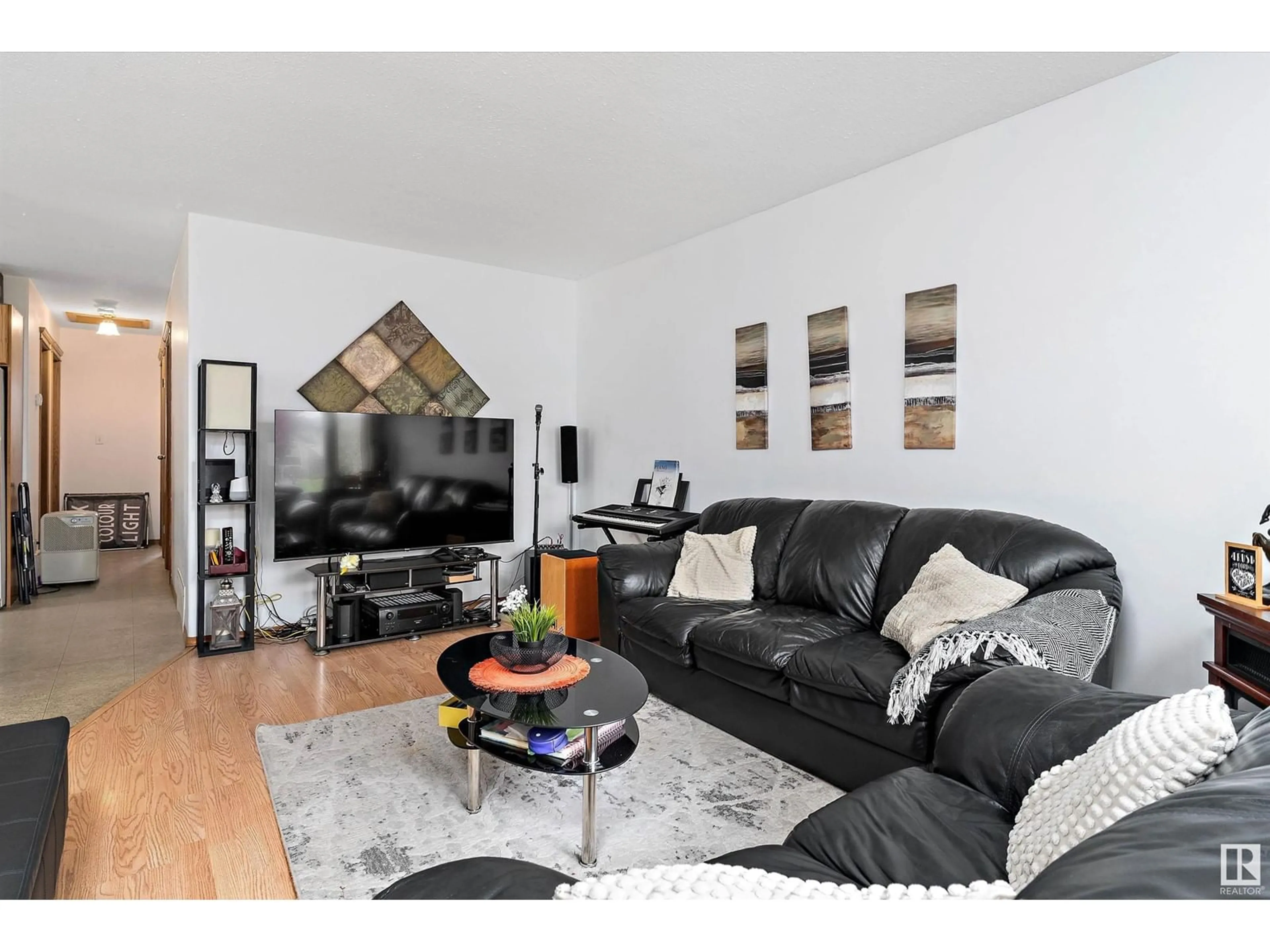 Living room with furniture, wood/laminate floor for 125 PARKSIDE DR, Wetaskiwin Alberta T9A3H1