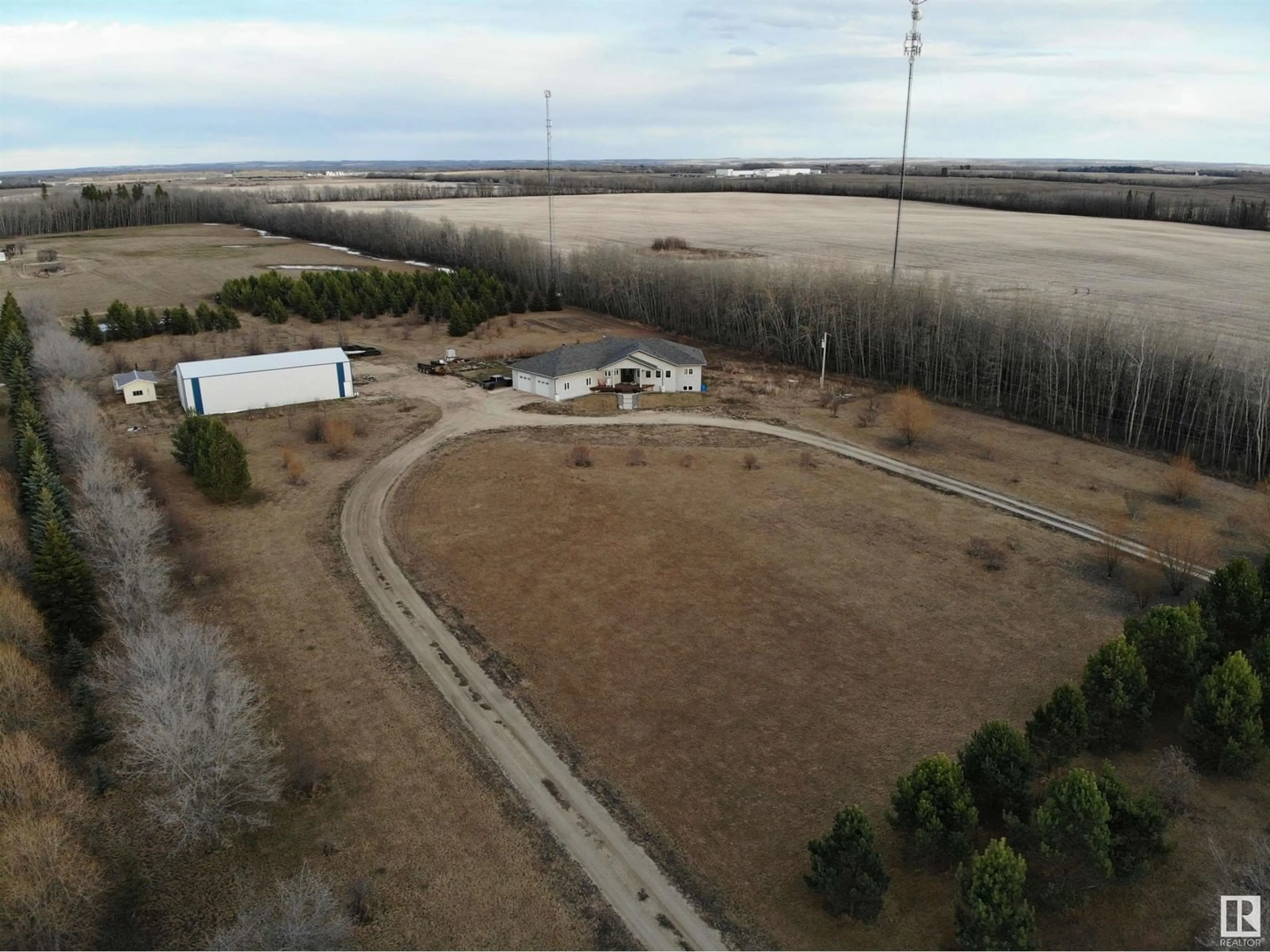 A pic from outside/outdoor area/front of a property/back of a property/a pic from drone, water/lake/river/ocean view for 59529A RGE RD 33, Rural Barrhead County Alberta T7N1N2