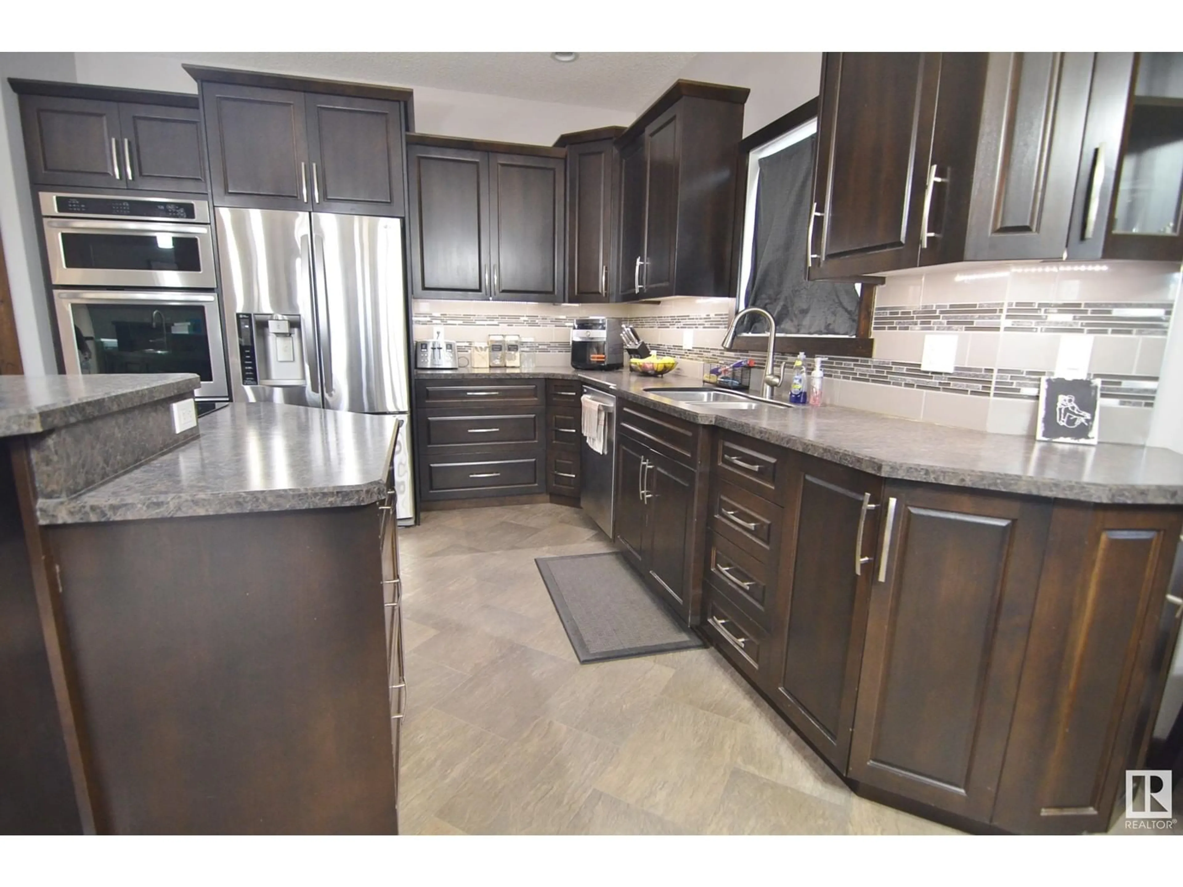 Open concept kitchen, ceramic/tile floor for 59529A RGE RD 33, Rural Barrhead County Alberta T7N1N2