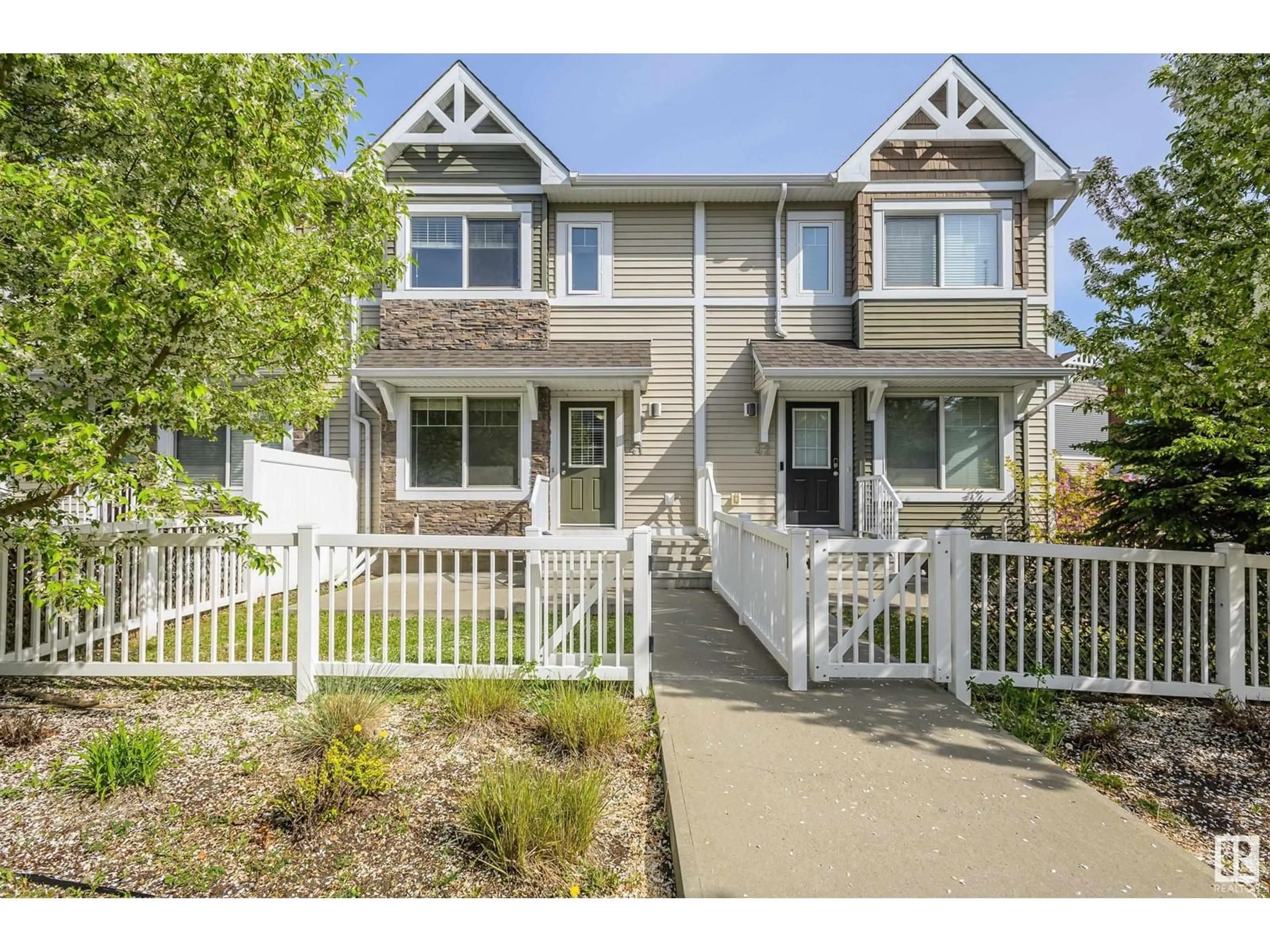 Home with vinyl exterior material, street for 415 - 41 CLAREVIEW RD, Edmonton Alberta T5A0Z6