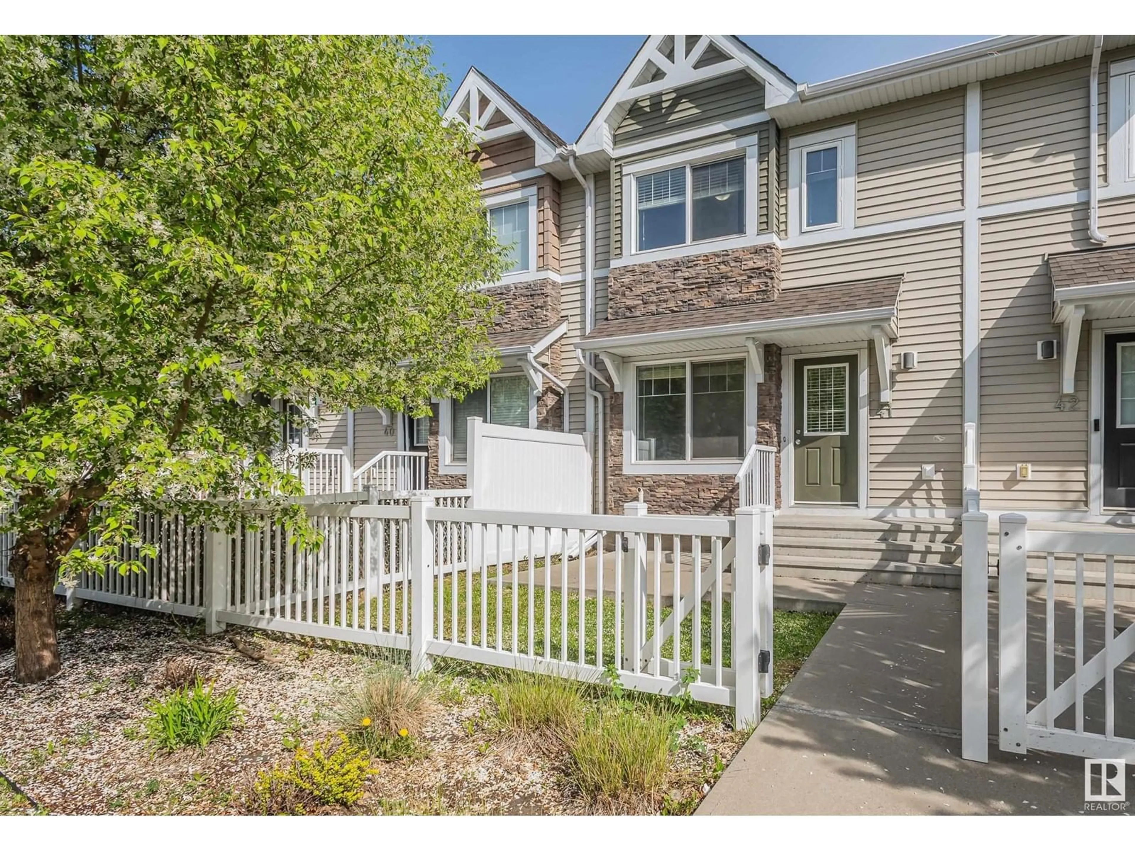 Home with vinyl exterior material, street for 415 - 41 CLAREVIEW RD, Edmonton Alberta T5A0Z6