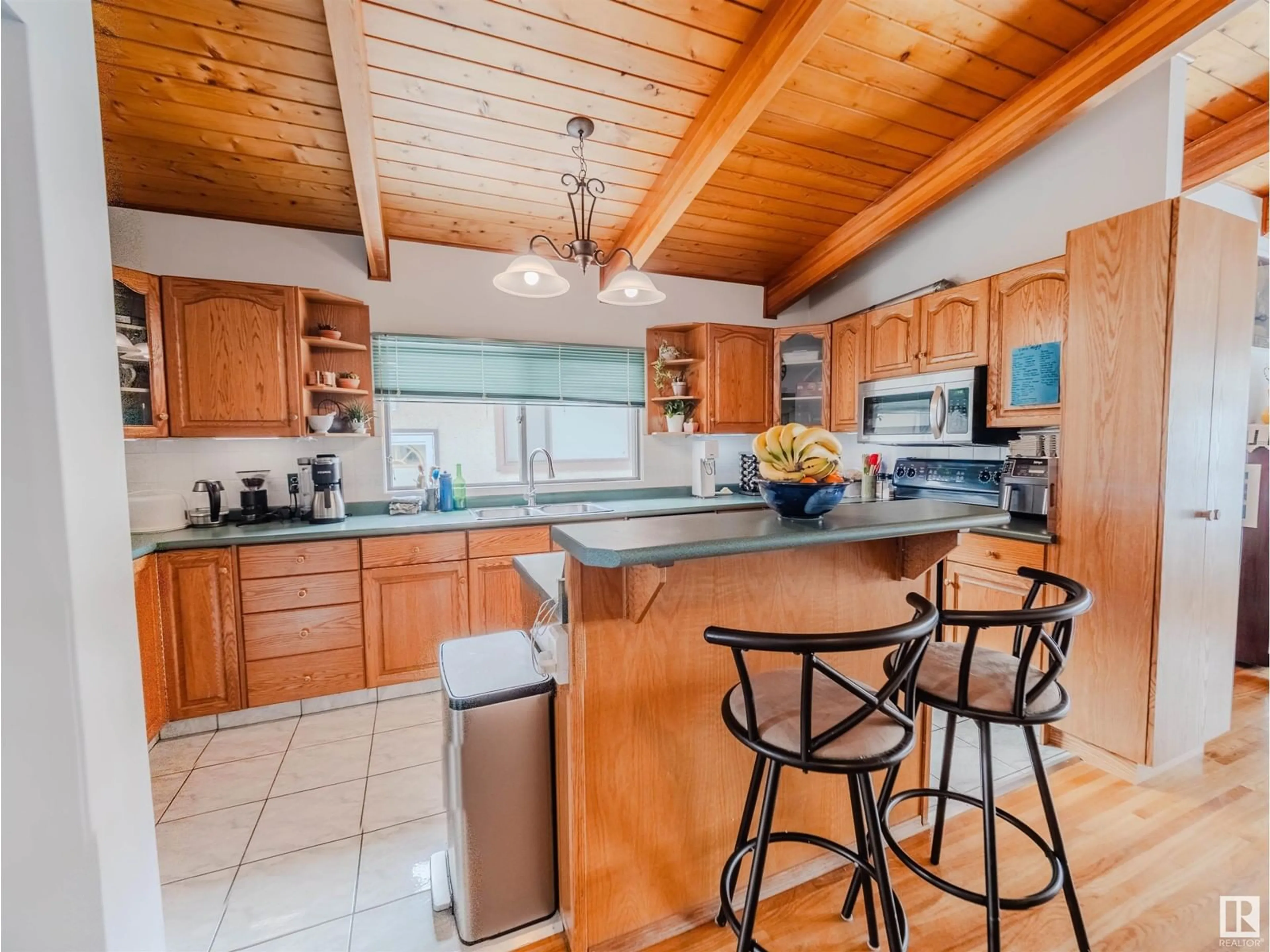 Open concept kitchen, ceramic/tile floor for 9023 60 ST, Edmonton Alberta T6B1M7