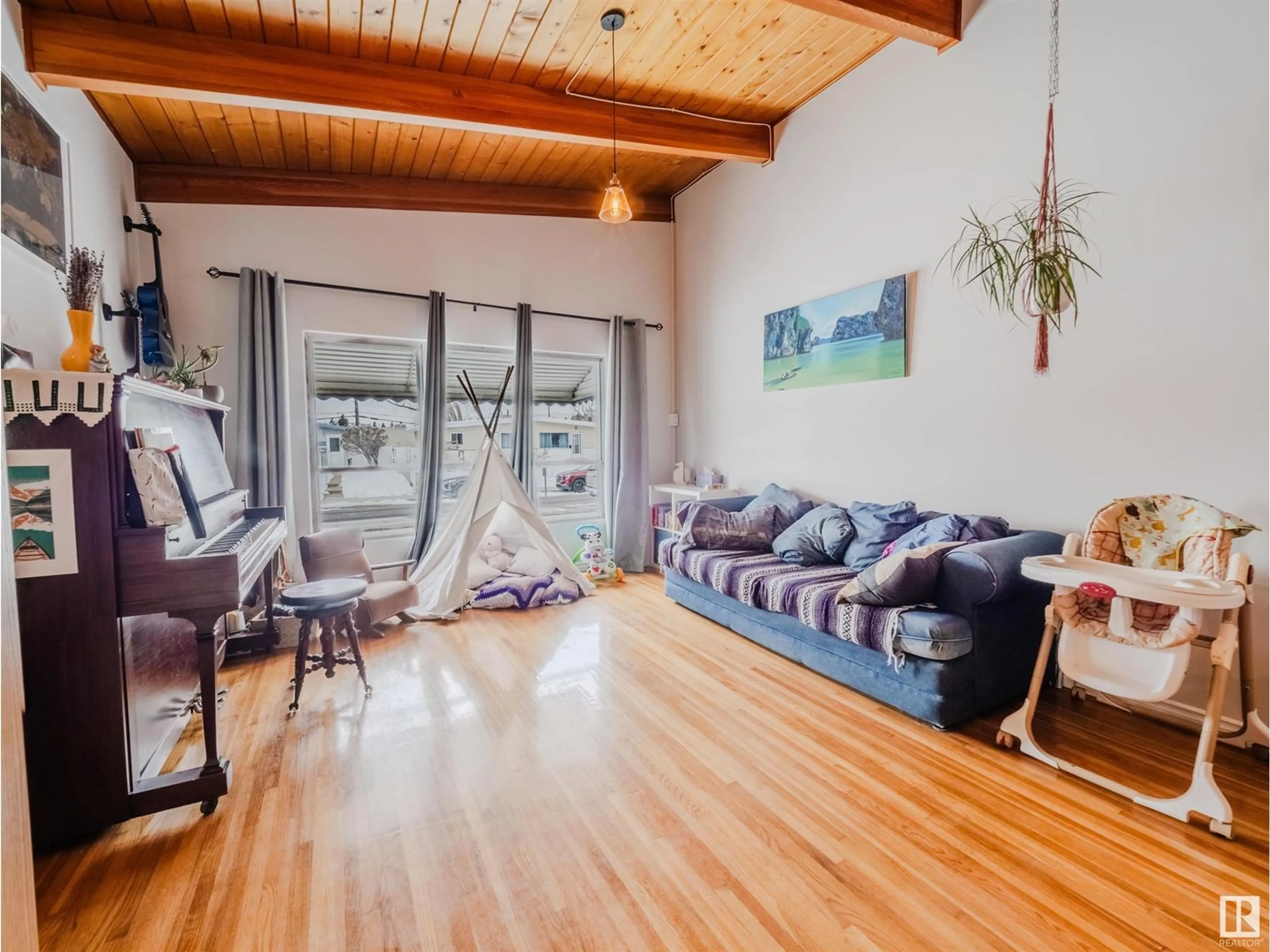 Living room with furniture, wood/laminate floor for 9023 60 ST, Edmonton Alberta T6B1M7